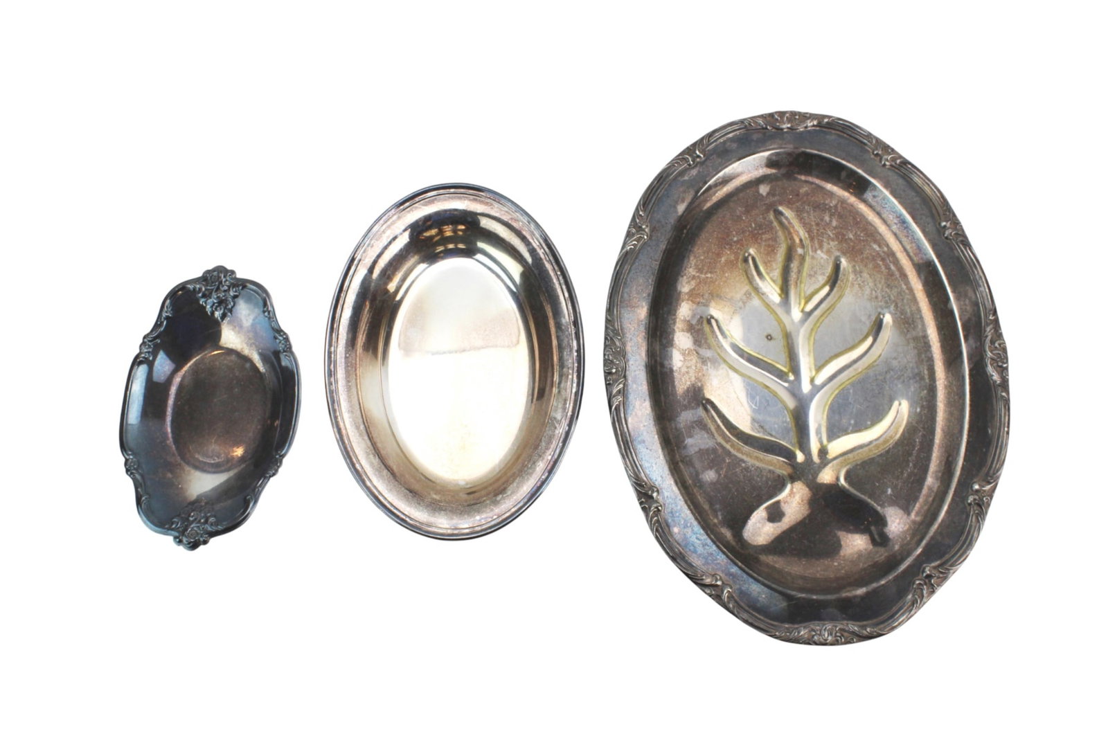 Set of Three Silver Plate Oval Trays: Group of three silver plate oval serving trays including a Pilgrim Silverplate meat tray, a Gorham YC426/4 oval dish, and an International Silver Co. No. 448 bowl with floral border. All show tarnish,
