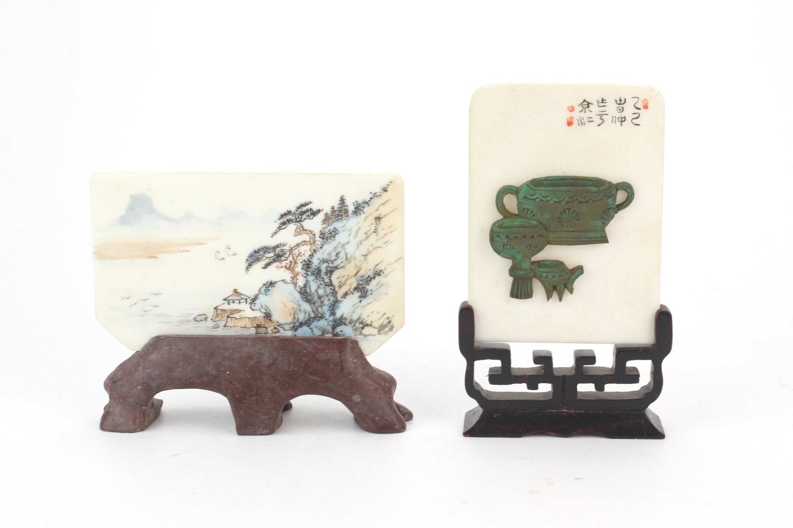 Pair of Marble Table Screen Panels: Two miniature marble table screen panels with landscape and soapstone archaic bronze style motif decorations. Measure 5 in. and 3 3/4 in. tall respectively. One signed and with carved wood stand and a