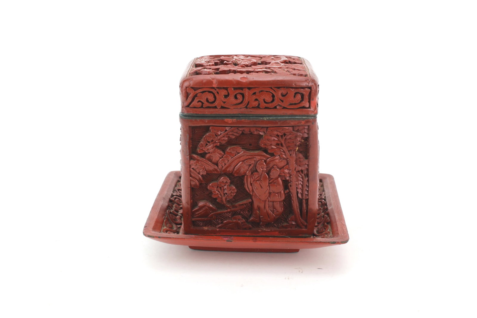 Cinnabar Tea Caddy with Fitted Tray: Carved cinnabar-style tea caddy with fitted dish, decorated with figural and landscape scenes in relief. Total size 4 in. (L) X 4 in. (W) X 3 1/2 in. (H). Surface wear, scattered losses to lacquer, cr