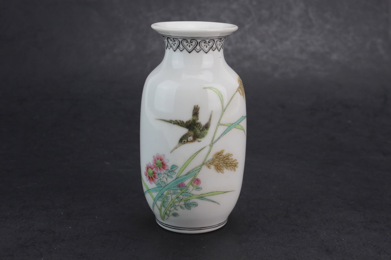 Chinese Famille Rose Bird Vase: Chinese famille rose porcelain vase decorated with bird, floral, and calligraphy motifs. Marked on the bottom. Measures 4 in. (H). Good overall condition with minor surface wear and light marks