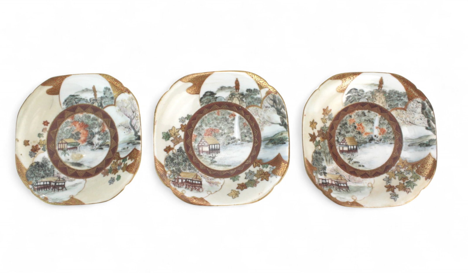 Set of Four Japanese Scenic Porcelain Dishes: Set of four Japanese porcelain dishes, decorated with scenic landscapes and gilt accents, with minor wear and firing flaws. Each approx. 4 1/2 in. square by 1 in. high.