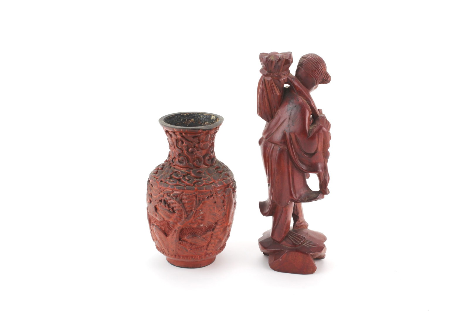Chinese Cinnabar Vase & Wood Carved Figure: Two Chinese collectibles including a carved cinnabar lacquer vase with relief decoration in approx. 4 in. (H), and a wood carved figure measuring approx. 6 in. (H). Condition: with surface wear,