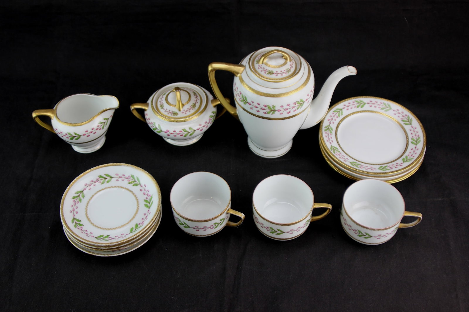 Lot of 14 PCS Victoria Austria Tea/Coffee Set: Lot of 14 PCS Carlsbad Victoria Austria Tea/Coffee Service set, featuring a hand-painted pink berry and green leaf garland design with rich gold trim. Includes one teapot in 7 1/2 in. tall; one lidded