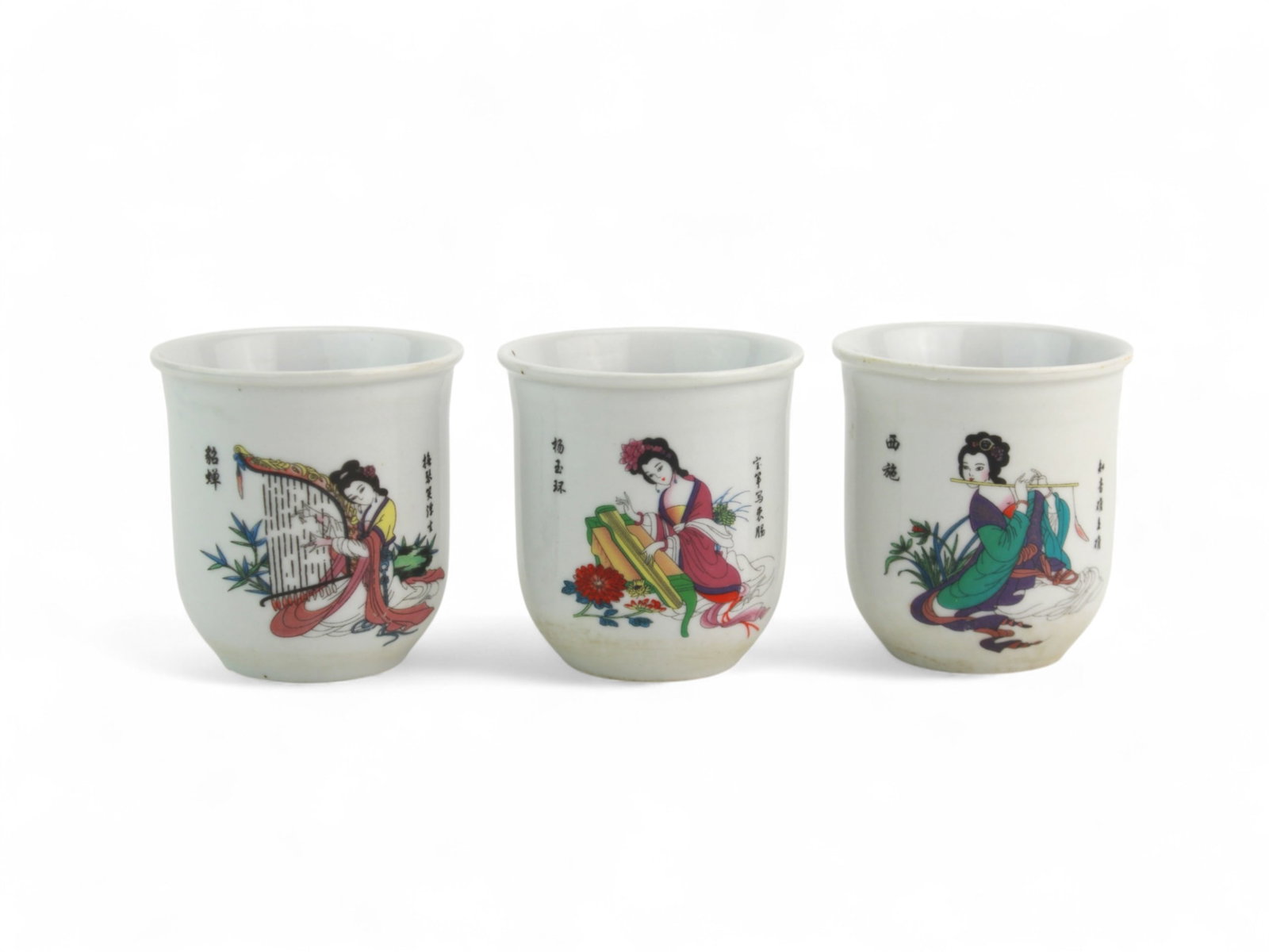 Three Chinese Porcelain Tea Cups: Set of three porcelain cups, each featuring a colorful hand-painted lady with floral motifs on one side and poetic Chinese calligraphy on the reverse. Finely detailed with overglaze enamel, Each cup m