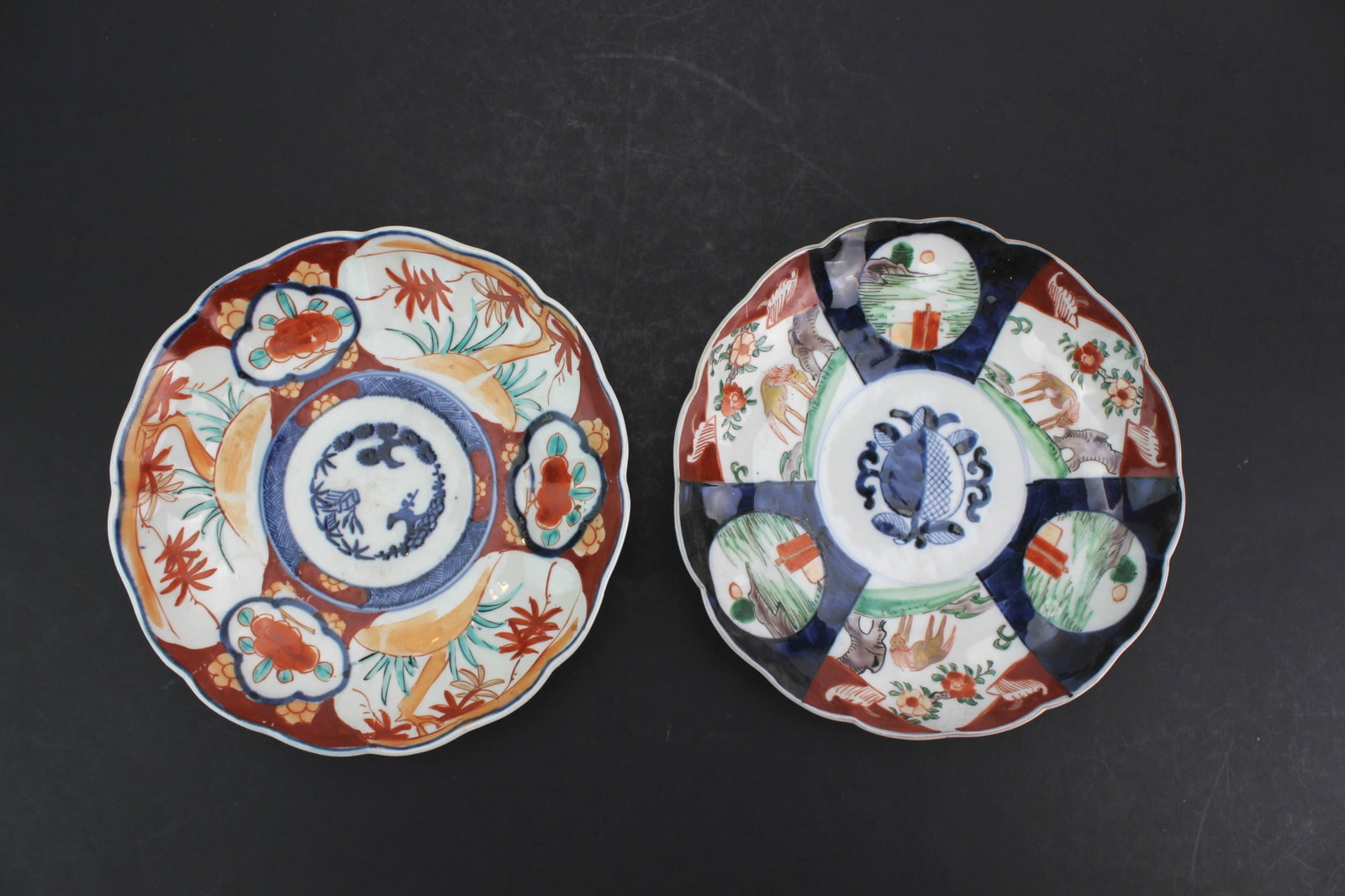 Pair Japanese Imari Porcelain Plates: Pair of Late Meiji Japanese Imari porcelain plates with polychrome decoration. Each measures 8 1/2 in. (D) X 1 1/2 in. (H). In good antique condition with light wear and minor glaze imperfections cons