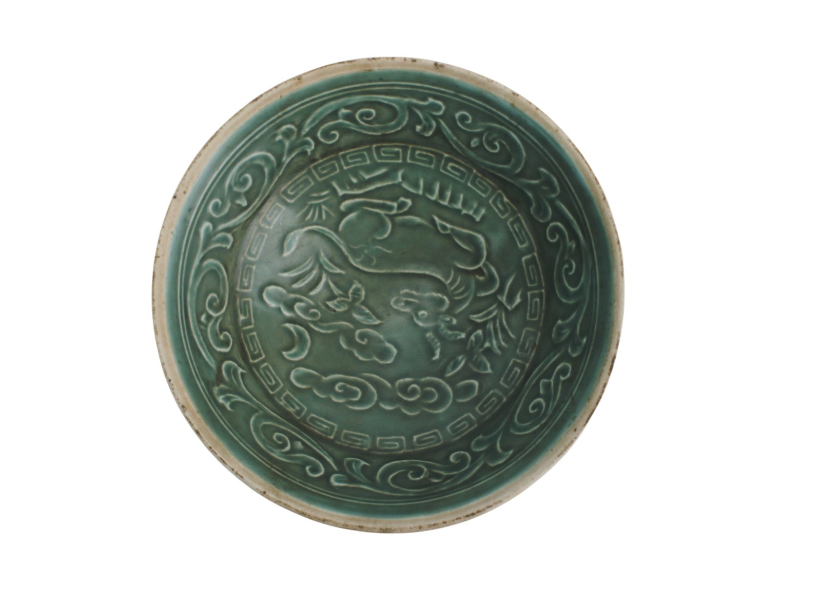 Chinese Green Glaze Carved Bowl: Chinese green-glazed bowl with molded interior decoration, featuring scrolling motifs beneath a smooth celadon-toned glaze. The bowl measures 4 3/4 in. (D) X 1 1/2 in. (H). Condition is good overall, 