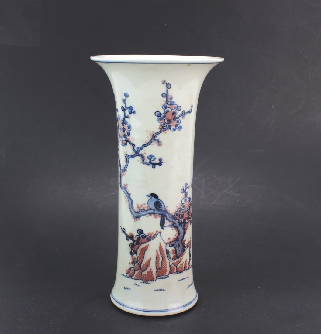 Chinese Famille Verte Vase w Bird: Chinese porcelain vase of flared trumpet form, decorated with a bird perched on a flowering branch in underglaze blue and iron-red enamel accents. Measures 9 in. (H) X 4 1/2 in. (D). Condition: