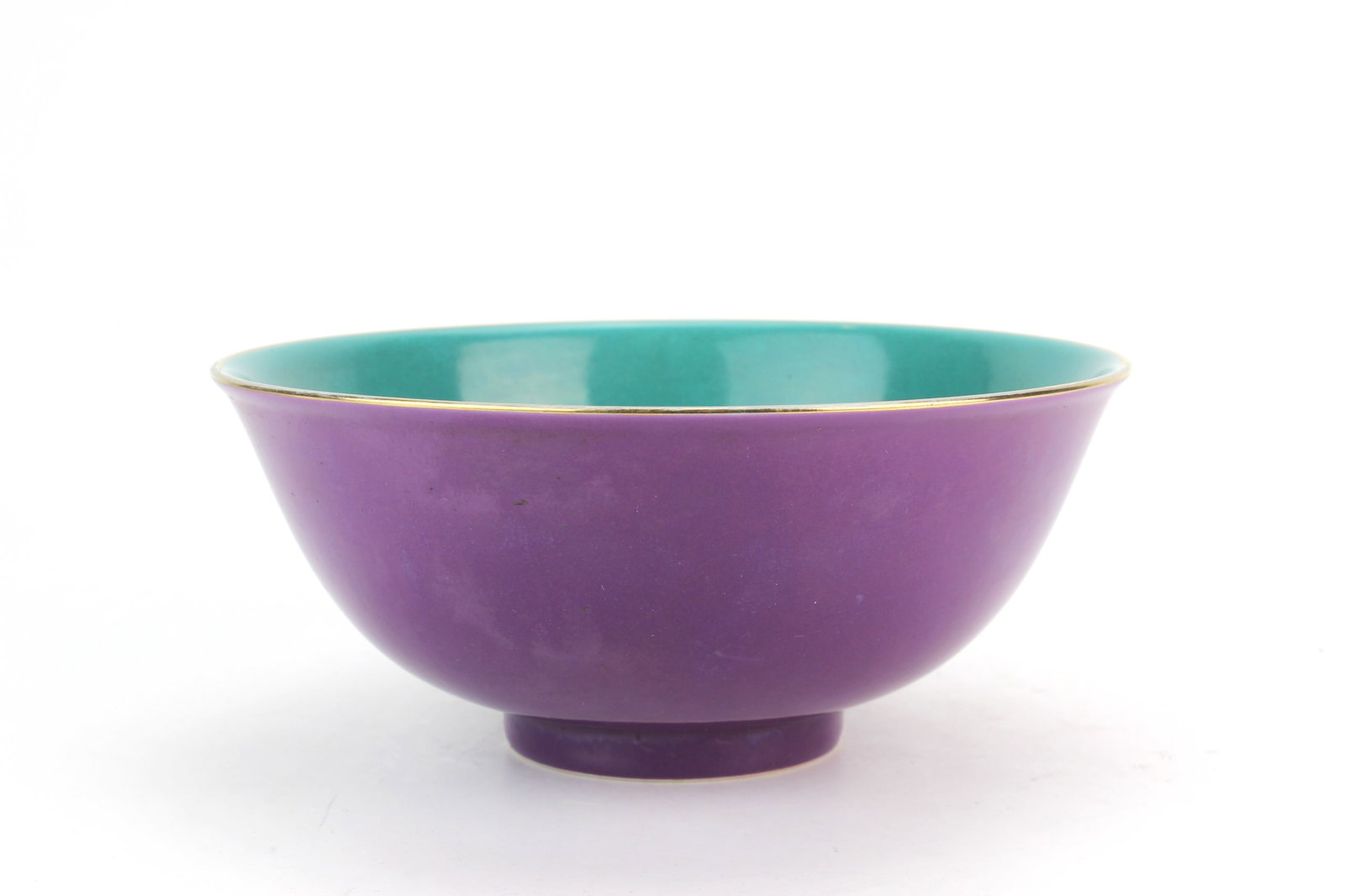Chinese Purple Glaze Porcelain Bowl: Chinese porcelain bowl with rich purple exterior glaze and turquoise-glazed interior, featuring a floral medallion at the center and underglaze seal mark to base. Measures 7 in. (D) X 3 in. (H).