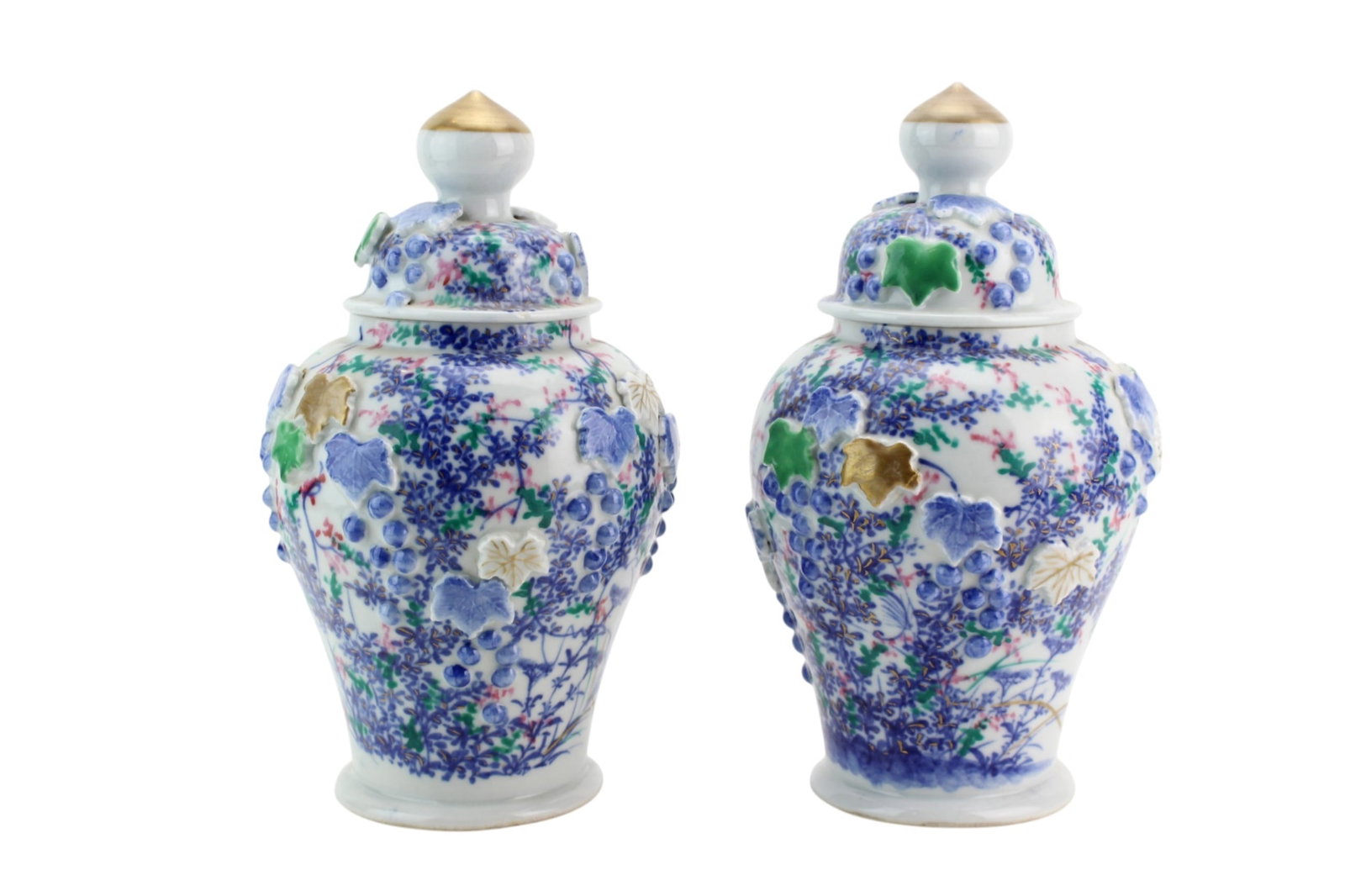 Pair Chinese Porcelain Lidded Jars: A decorative pair of Chinese porcelain lidded jars, featuring finely painted floral and vine motifs in cobalt blue, green, and iron-red tones, with applied relief decoration and gilt accents. Each jar