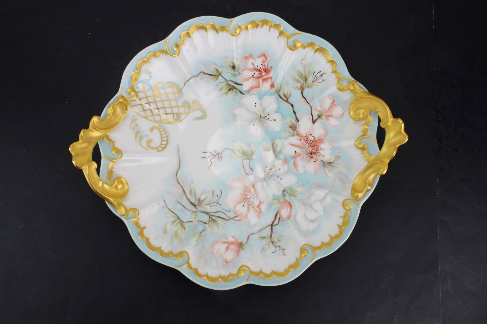 19th C Limoges Porcelain Bowl w/ Gilt Handles: Antique Limoges porcelain bowl with ornate gilt handles and hand-painted floral decoration on a pale blue ground. Marked J.P.L. France (Pouyat factory), with handwritten date ?June 2nd, 1898? on