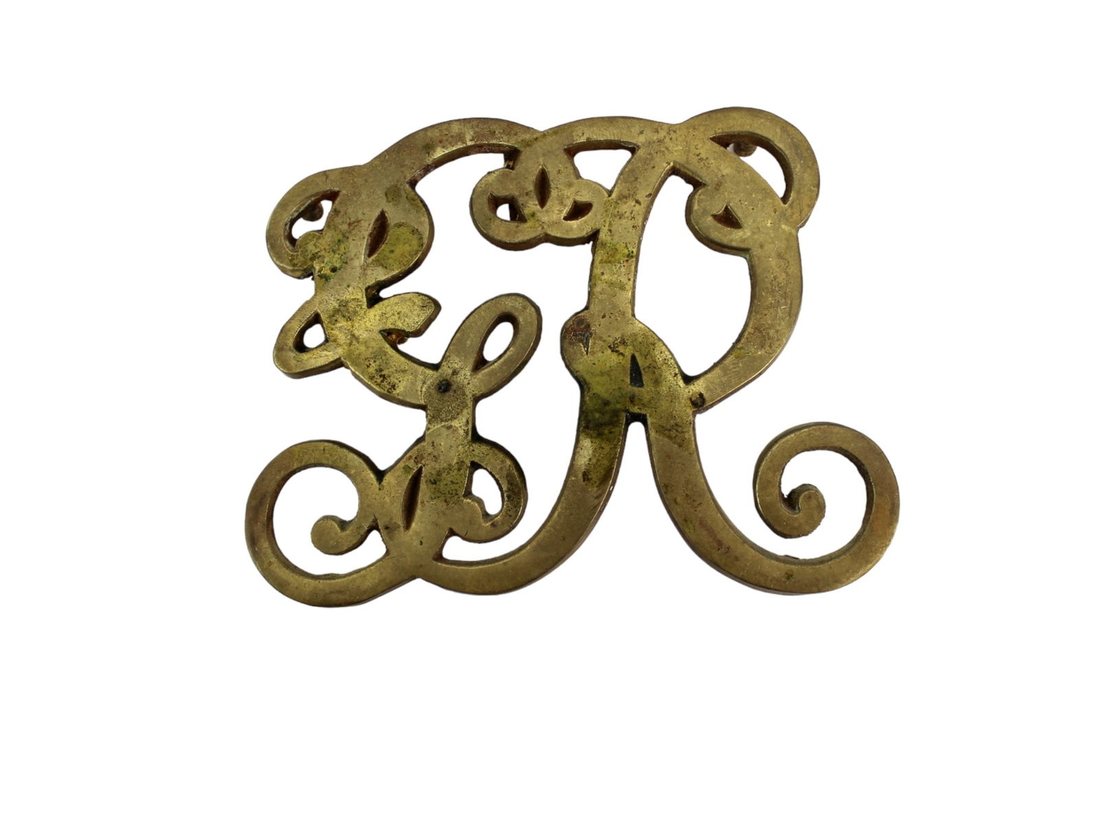 King George Cypher Die Cast Trivet: CW10-9 KIng George Cypher Brass Trivet, Williamsburg, Copyright 1950. Dimensions: Approx. 5 X 3 3/4 inches..