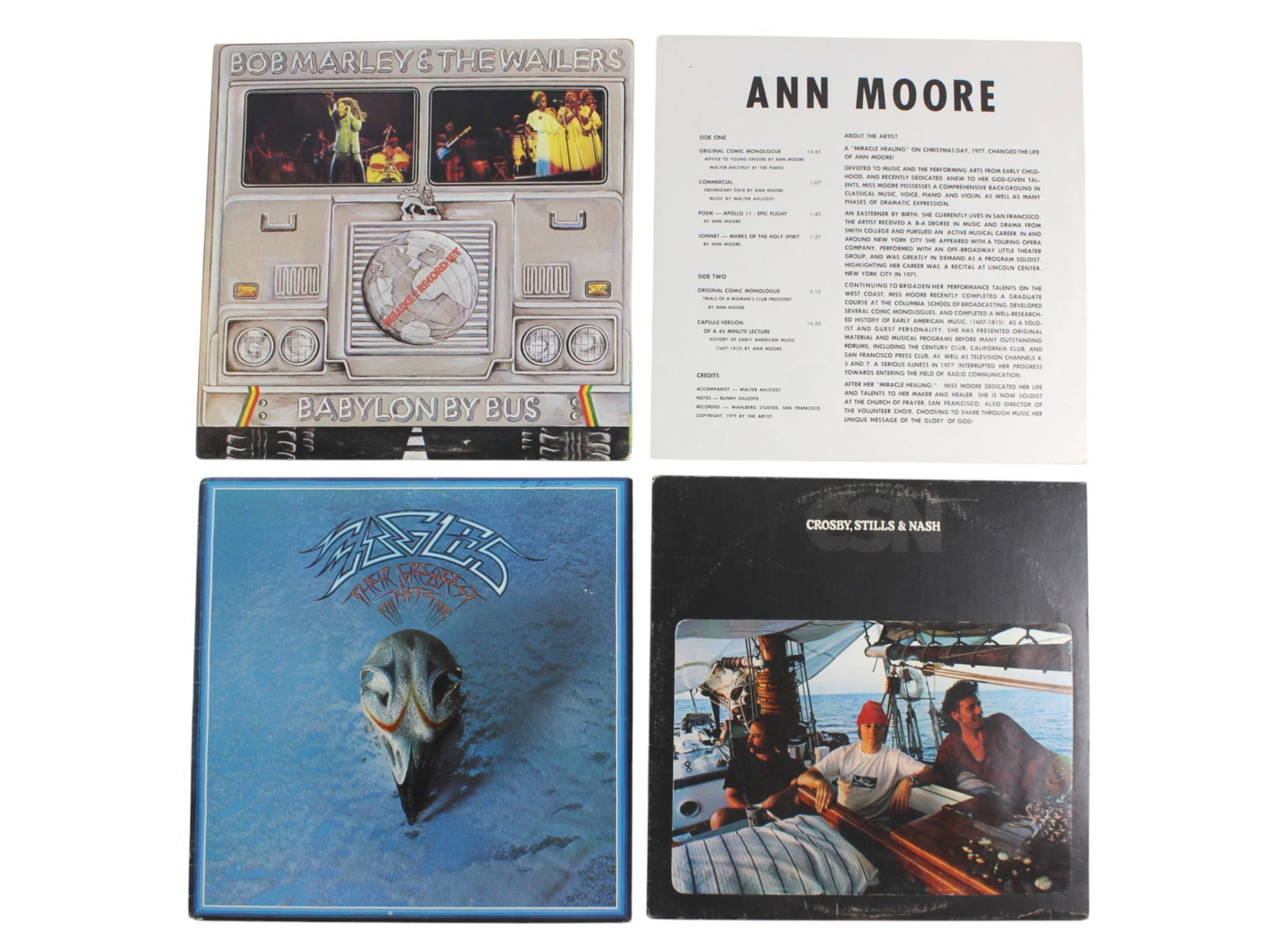 4 Classic Vinyl LPs, Reggae, Rock & Spoken Word: Group of four vintage vinyl records featuring legendary artists and genres, including Bob Marley & The Wailers' Babylon by Bus (2-LP live album), Ann Moore?s spoken-word monologue LP, Eagles? Greatest