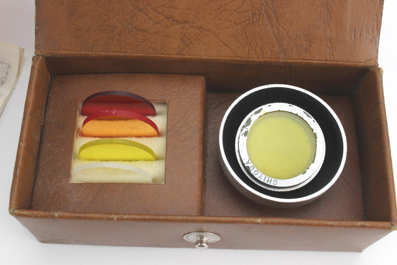 Vintage Camera Filters & Adapter Set: Vintage camera accessory group including a Rothco No. C-2 screw-in color filter kit with original fitted case and instruction booklet, assorted red, orange, yellow, and clear filters, plus two yellow