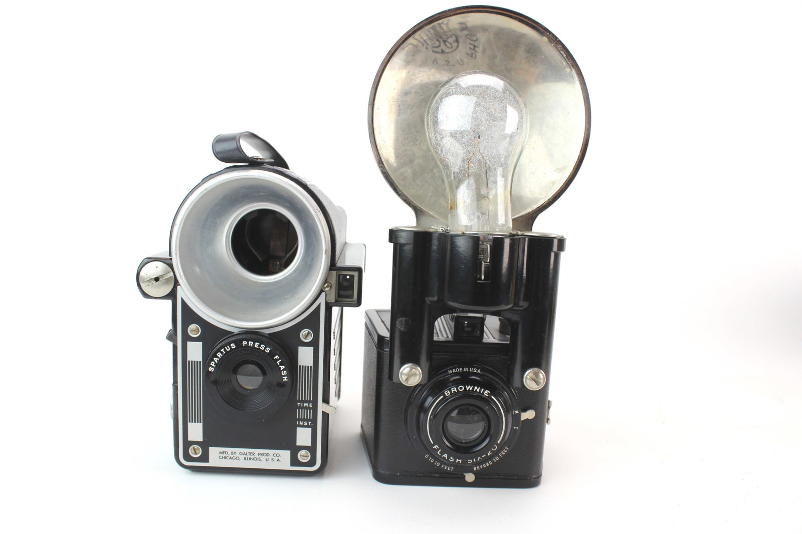 Spartus Press Flash & Brownie Flash Six-20 Cameras: The set including one Spartus Press Flash camera from Galter Prod. Co. Chicago, Illinois. C1955, 120 film, 6X9 cm exposure box-type camera; and one Kodax Eastman Brownie Flash Six-20 Camera, C 1946-19