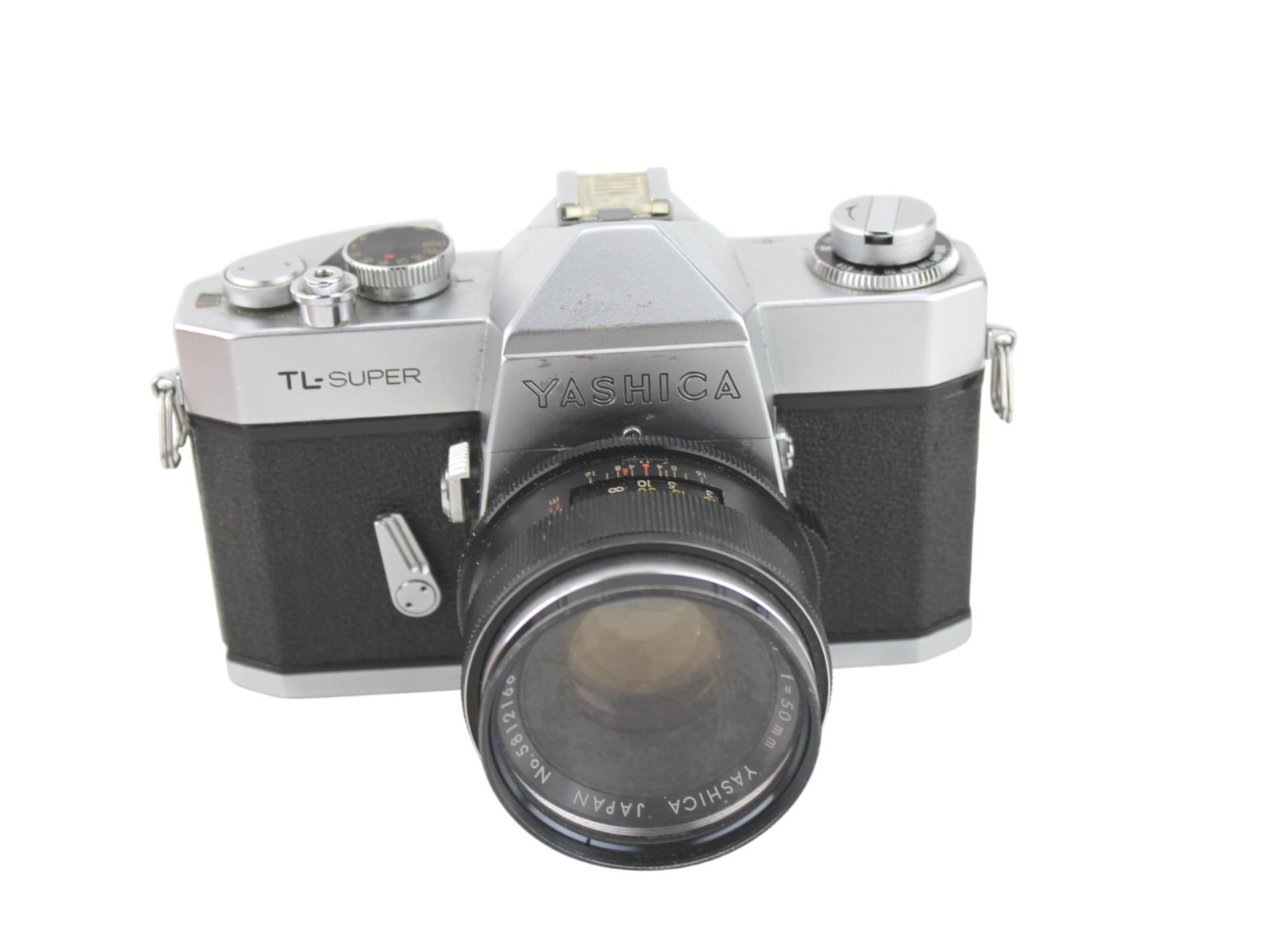 YASHICA TL-SUPER 35MM SLR CAMERA: Yashica TL-Super 35mm film SLR camera. Circa 1967. The film advance was locked, and the shutter wouldn't fire.