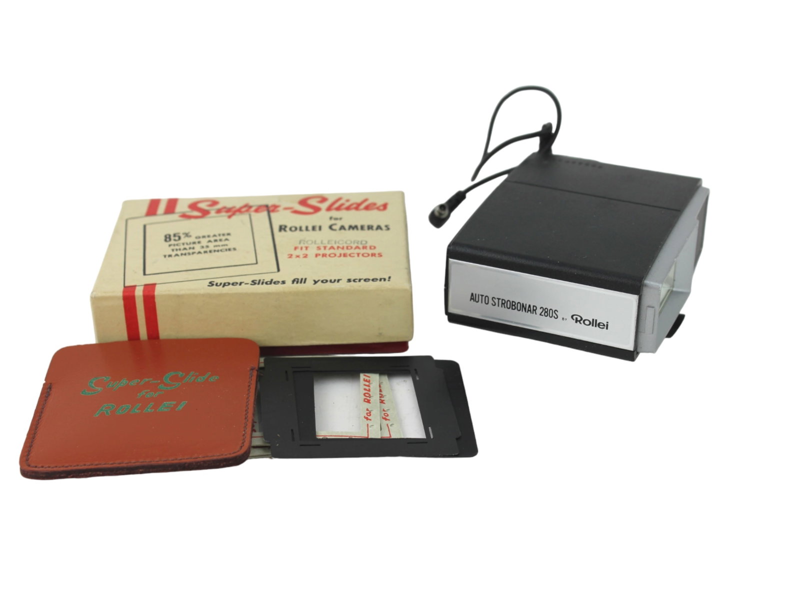 TWO ROLLEI PHOTOGRAPHIC ACCESSORIES: includes Super-Slides and Auto Strobonar 280S flash.