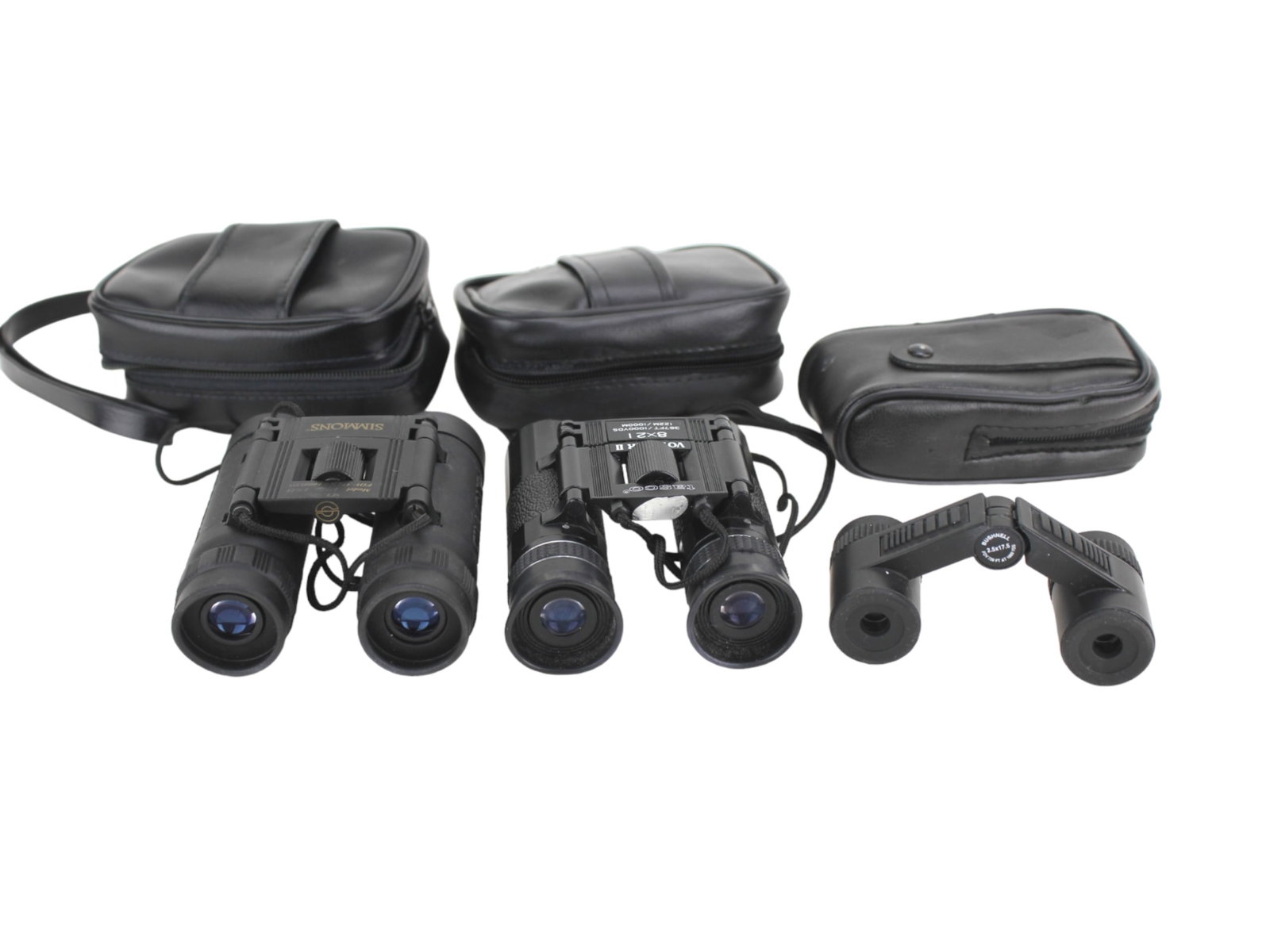 THE LOT OF THREE BINOCULARS: Including a Simmons 8 X 21 binoculars, a Tasco Voyager II 8 X 21 binoculars, and a Bushnell 2.5 X 17.5 binoculars.