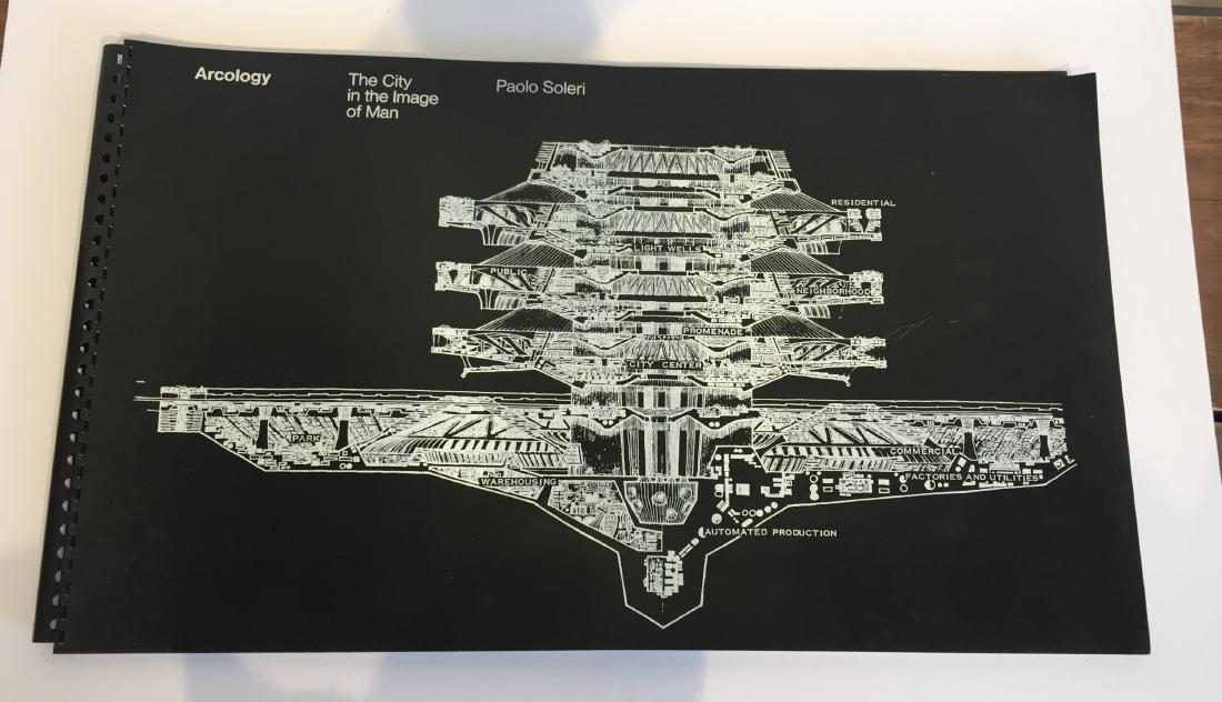 Arcology The City in the Image of Man by Paolo Soleri: Oversized book with soft plastic covers. Closed, it measures 24" wide and 14 1/4" high.