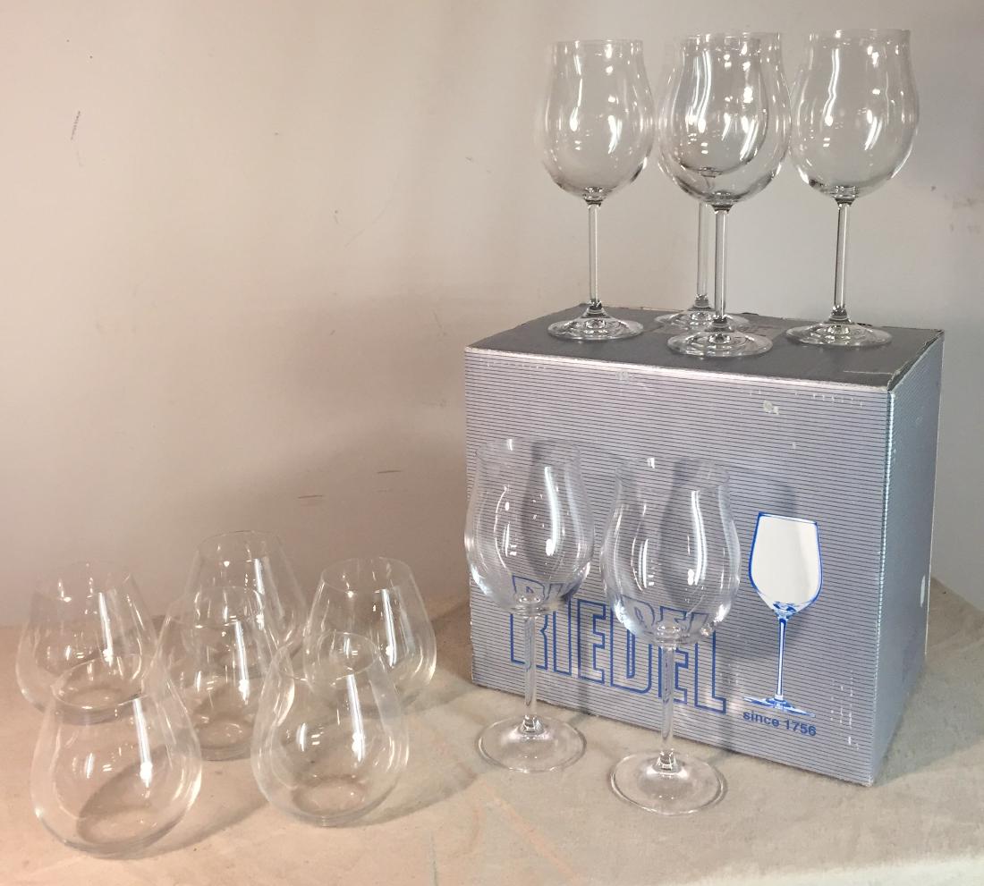 Riedel Wine Glass Lot: Two sets of 6 Riedel wine glasses. The stems have original box and measure 9" tall. The stemless measure 4 1/2" tall.