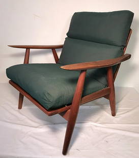 Hans Wegner for Getama Teak Lounge Chair: Mid century armchair in teak with single green cotton upholstered cushion. 27.25"W x 28"D x 31"H