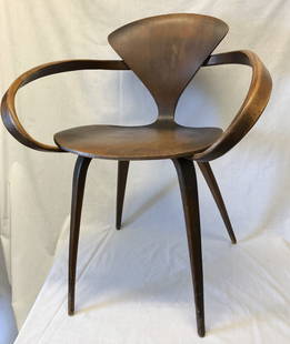 Norman Cherner Mid Century Pretzel Chair Plycraft: All original vintage example of a truly iconic design. It retains its original tag and a retailers label over top of it. This chair is in untouched condition with almost no damage (one veneer chip to