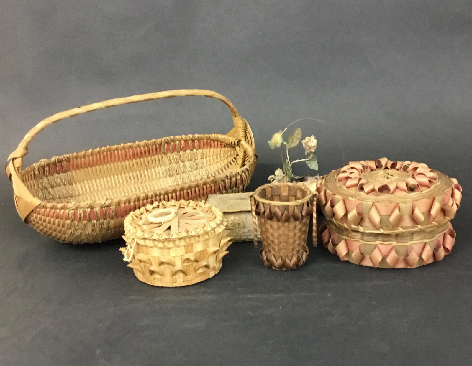Lot of Antique Victorian Native American Baskets: Nice attic lot of 6 pieces of antique basketry sweetgrass and birch bark. There is a long low handled basket 11.5", 2 lidded sewing baskets the larger of which is 5.5" across, a terrific little basket