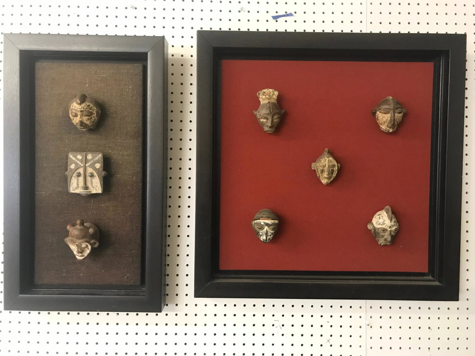 Mounted African Passport Masks Dan Tribe: Two frames with a total of 8 masks. Pottery figural pieces mounted on burlap.
