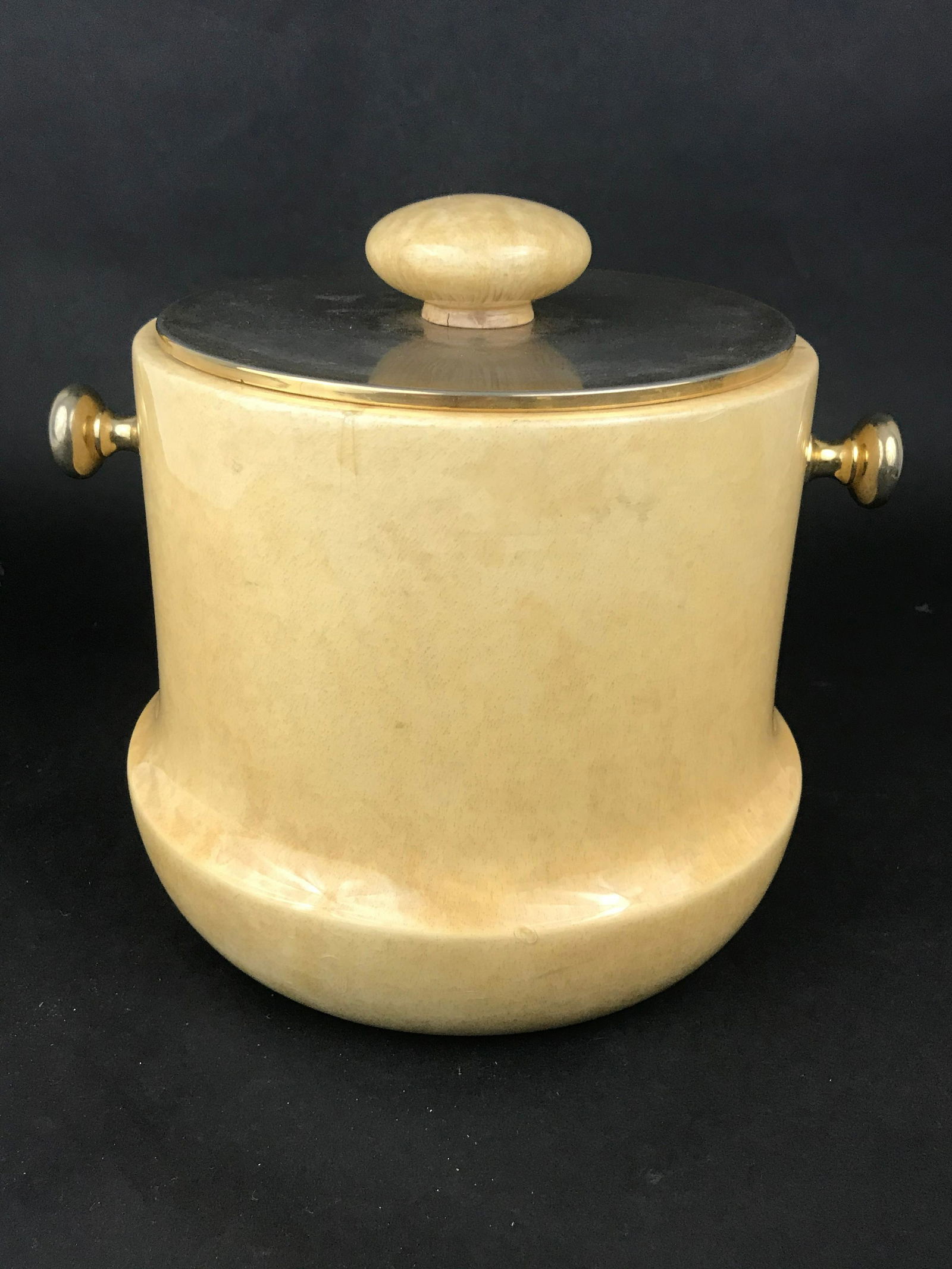 Aldo Tura Cream Parchment Ice Bucket: Ice Bucket attributed to Aldo Tura with a cream colored parchment. 10" x 9" x 9"