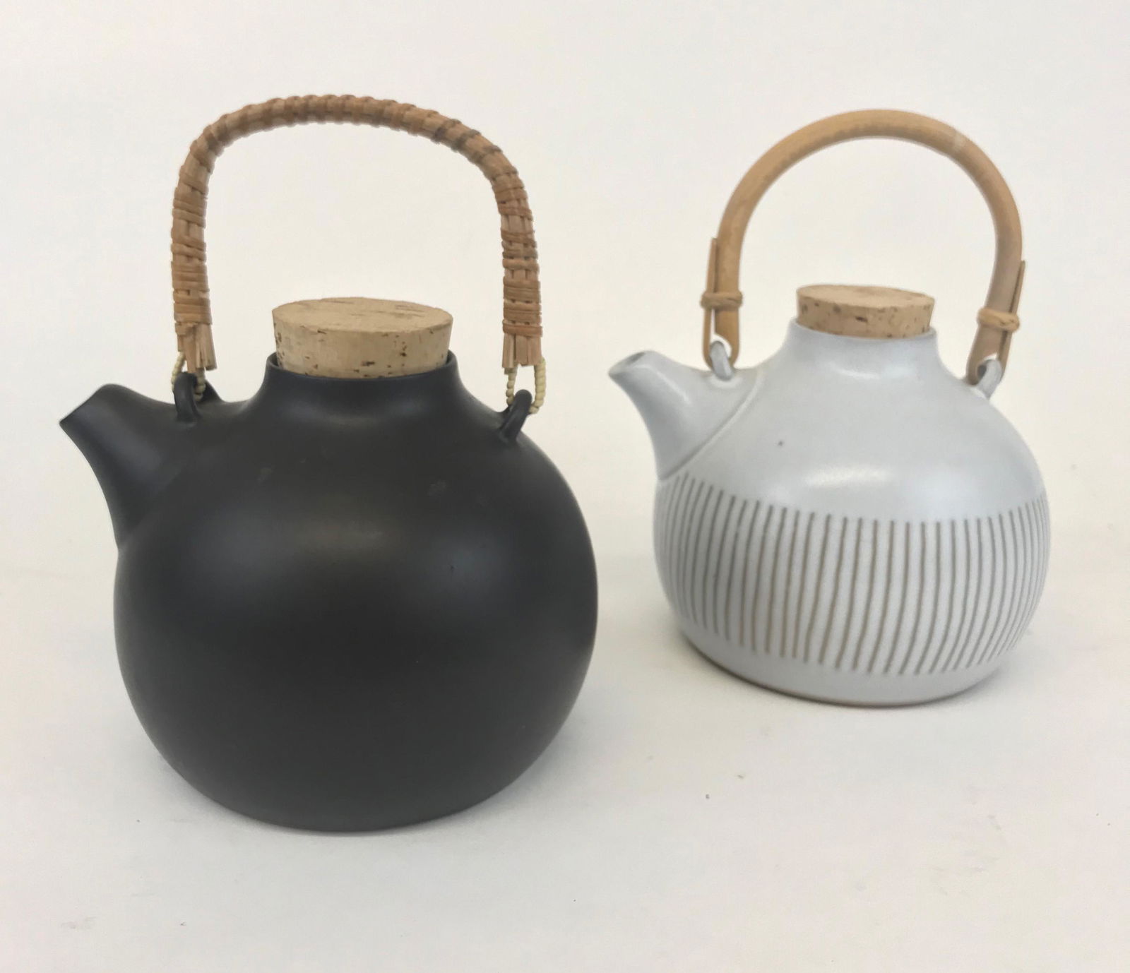 Lot 2 Martz Ceramic Teapots Marshall Studios: 2 ceramic teapot by Gordon and Jane Martz, Black one is signed. 7.75"W, 9"H to top of handle. Both in very good condition!