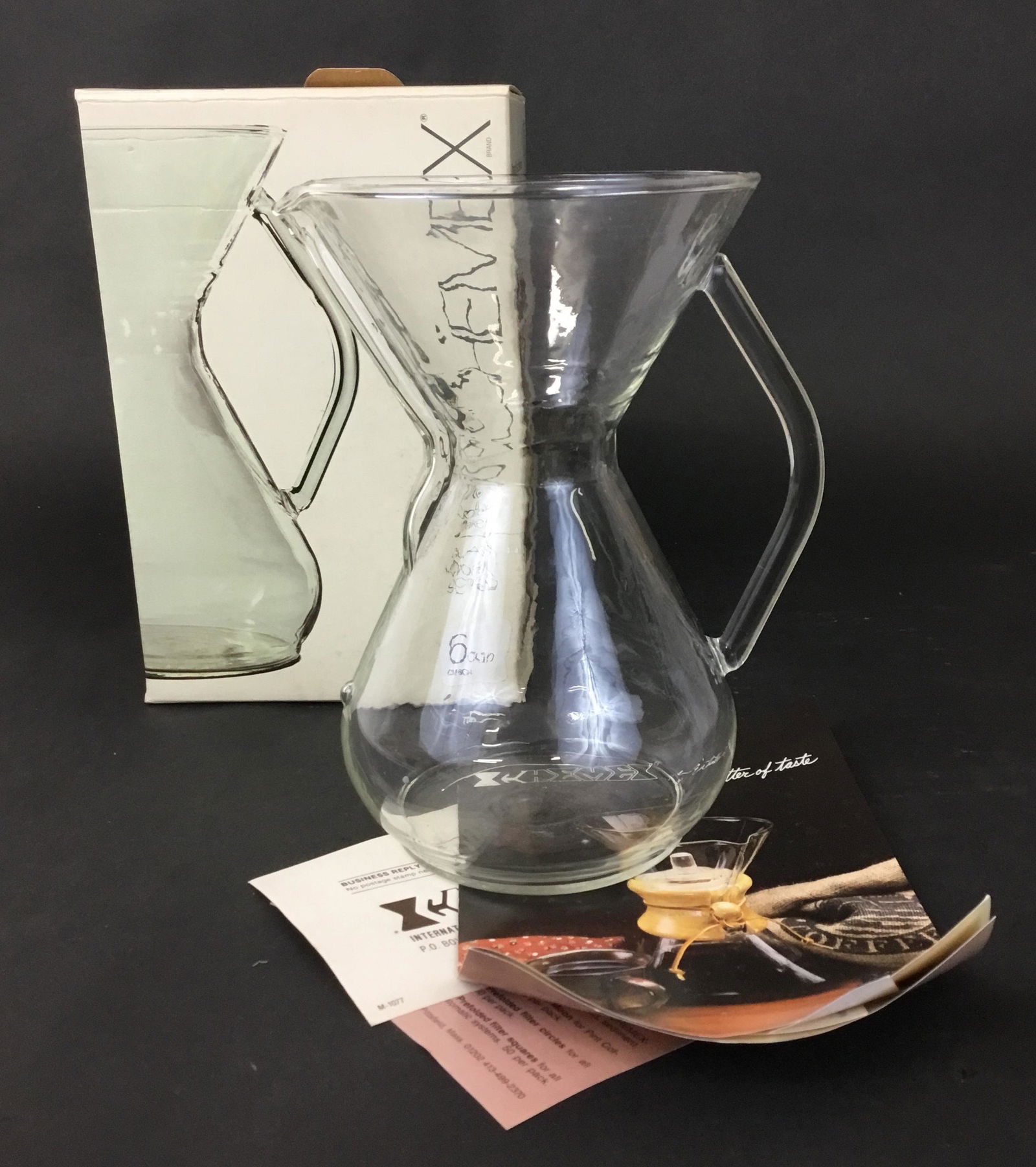 Vintage Chemex in Box Never Used: Brand new old glass Chemex 6 cup coffee maker in box with paperwork. Box dated 1985. Chemex measures 8.5" tall.