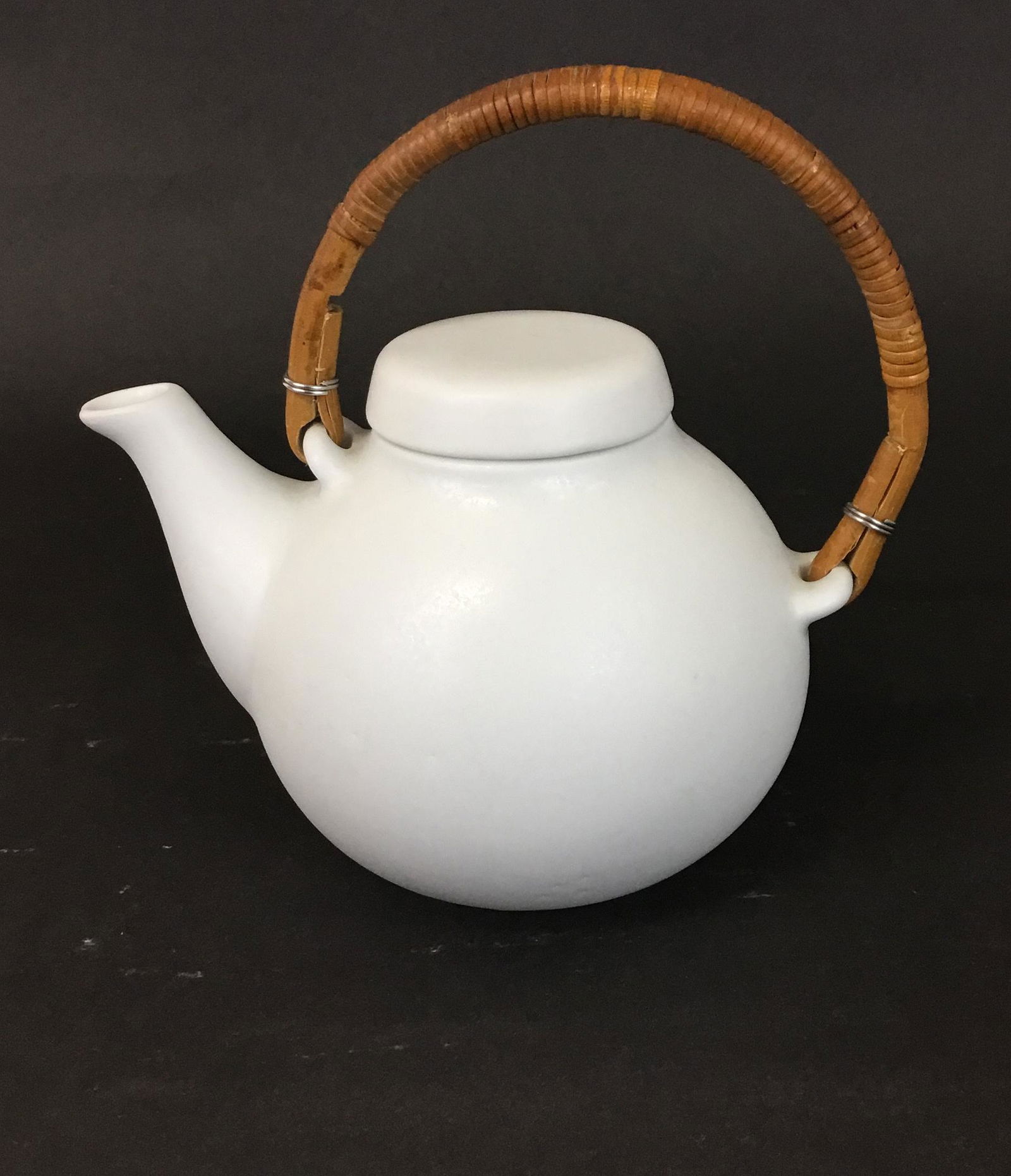 Small Arabia Ceramic Teapot Ulla Procope: Small sized pottery teapot designed by Ulla Procope for Arabia Finland with a lovely eggshell ivory white glaze. Marked on the base. 7" from spout to handle. Body is 4.75" tall, with handle it is 6.5"