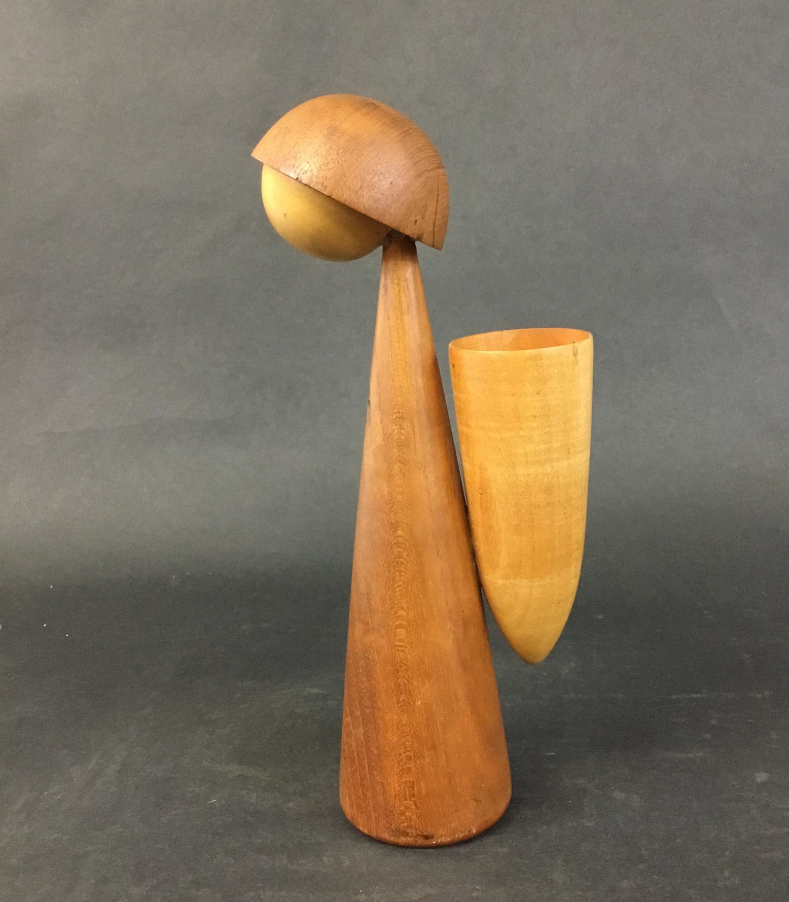 G Rath Teak Bud Vase Girl with Basket: Sticker on base reads G. Rath P Anker Hansen with a windmill. Stylized figure of girl with basket. Has been repaired at neck. 10" tall.
