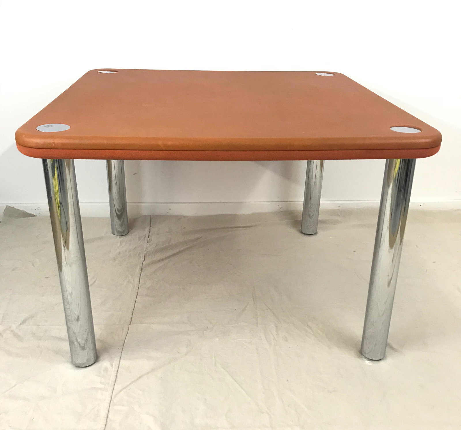 Knoll Game Table with Chrome Legs & Reversible Felt &: Game table with chrome legs with an orange top with leather on one side and felt on the other. Legs screw off and can be flipped to other side. 42" x 42" x 29"