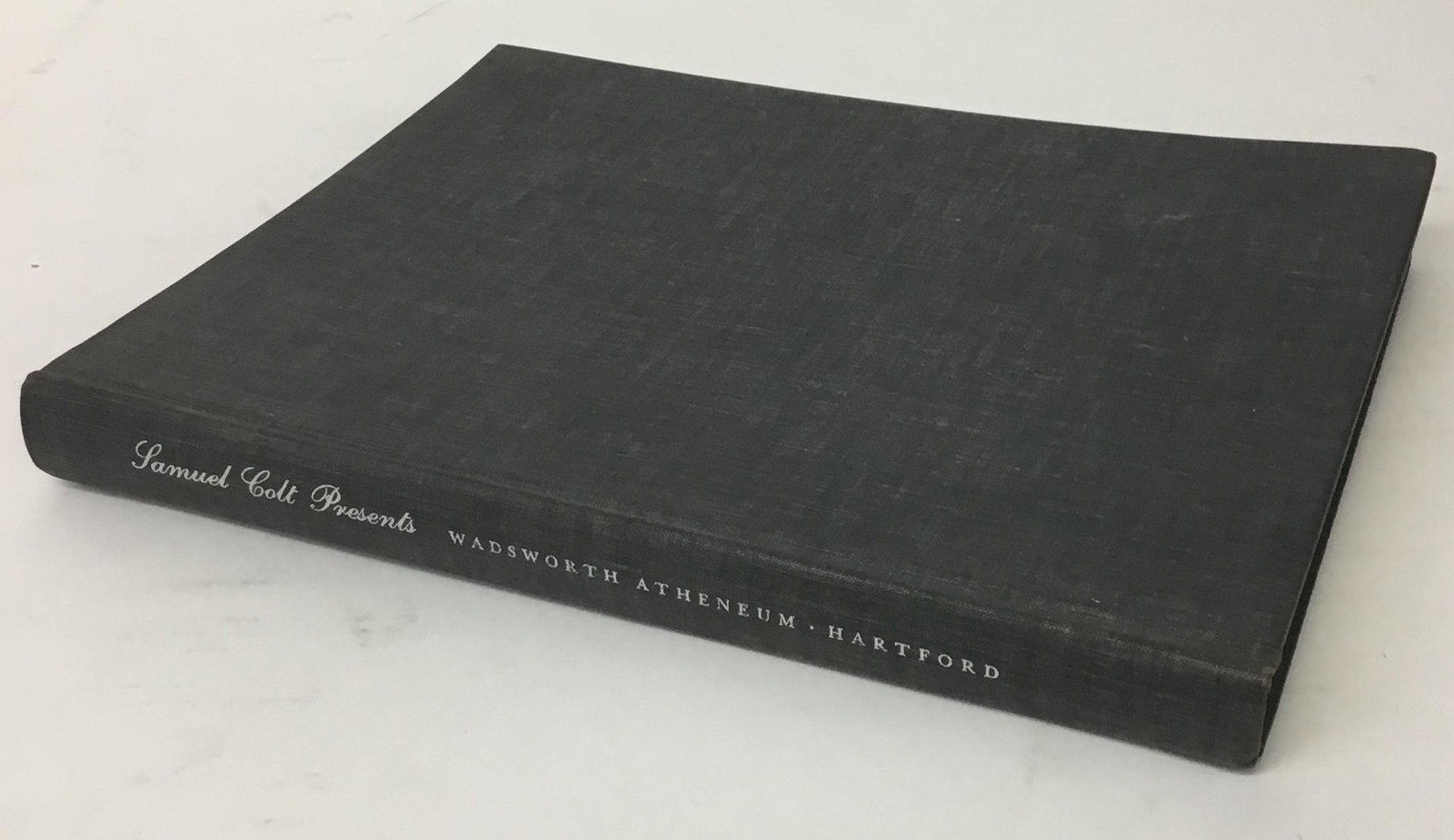 1961 Samuel Colt Presents Loan Exhibition Catalog: Hardbound 1961 catalog of the Samuel Colt percussion firearms exhibition. Hartford CT, Wadsworth Atheneum. Filled with black and white photos of the gun exhibition.
