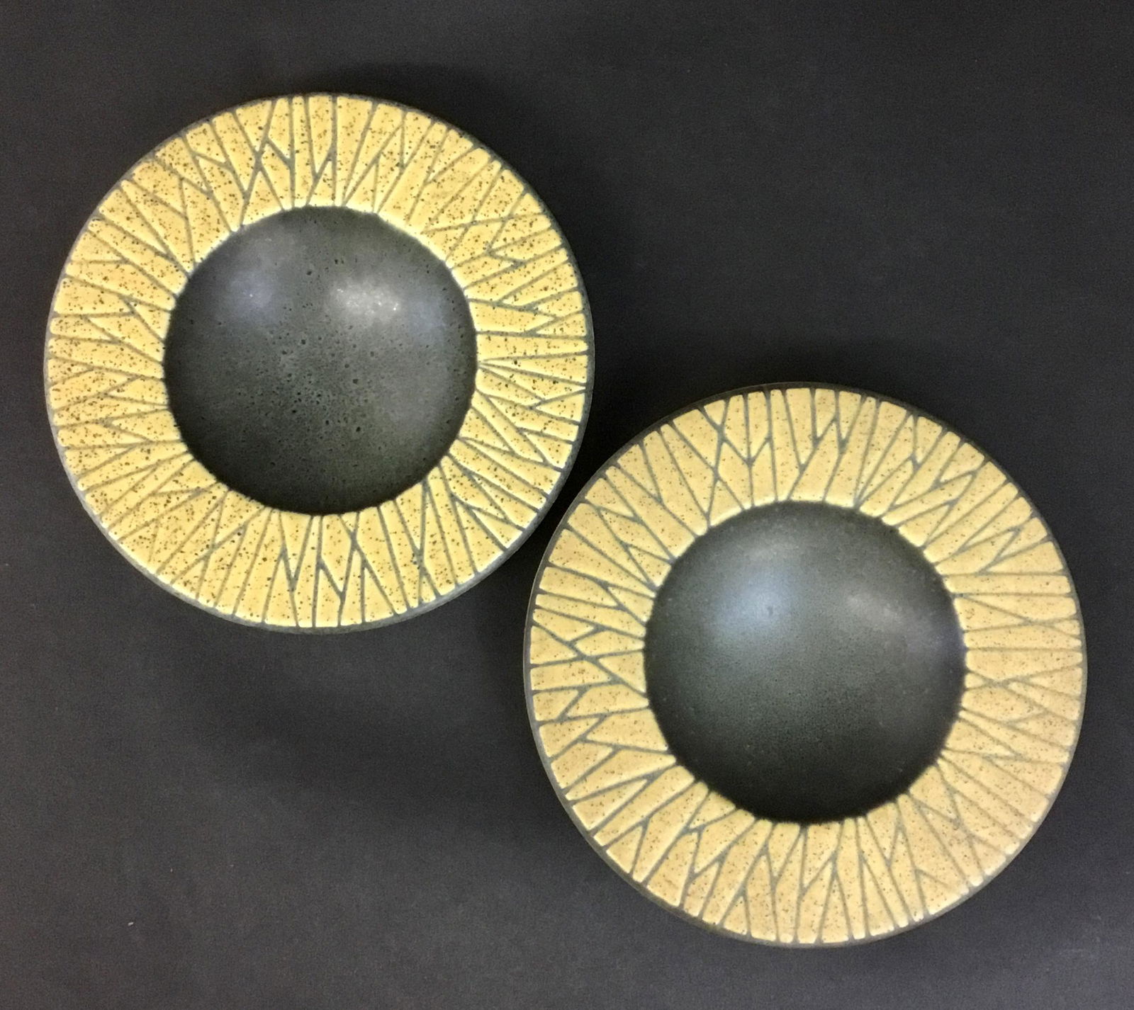 Pair Vintage Gustavsberg Mid Century Dishes Larson: Two matching ceramic shallow bowls attributed to Lisa Larson or Stig Lindberg for Gustavsberg. Patterned rim in yellow with great mossy green glaze inside. Each is 6.25" across and 1.25" tall. Missing