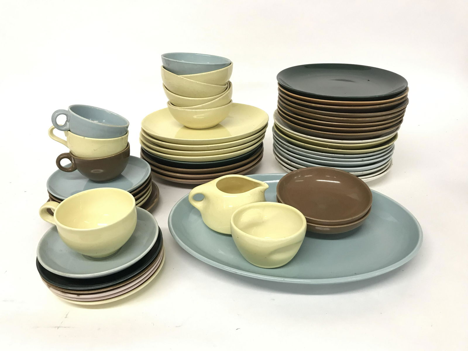 53 Piece Dish Lot Russel Wright for Iriquios: 53pc Mixed lot of riquois dishes by Russel Wright. Includes stacking sugar and creamer and a platter. Largest 14" x 11"