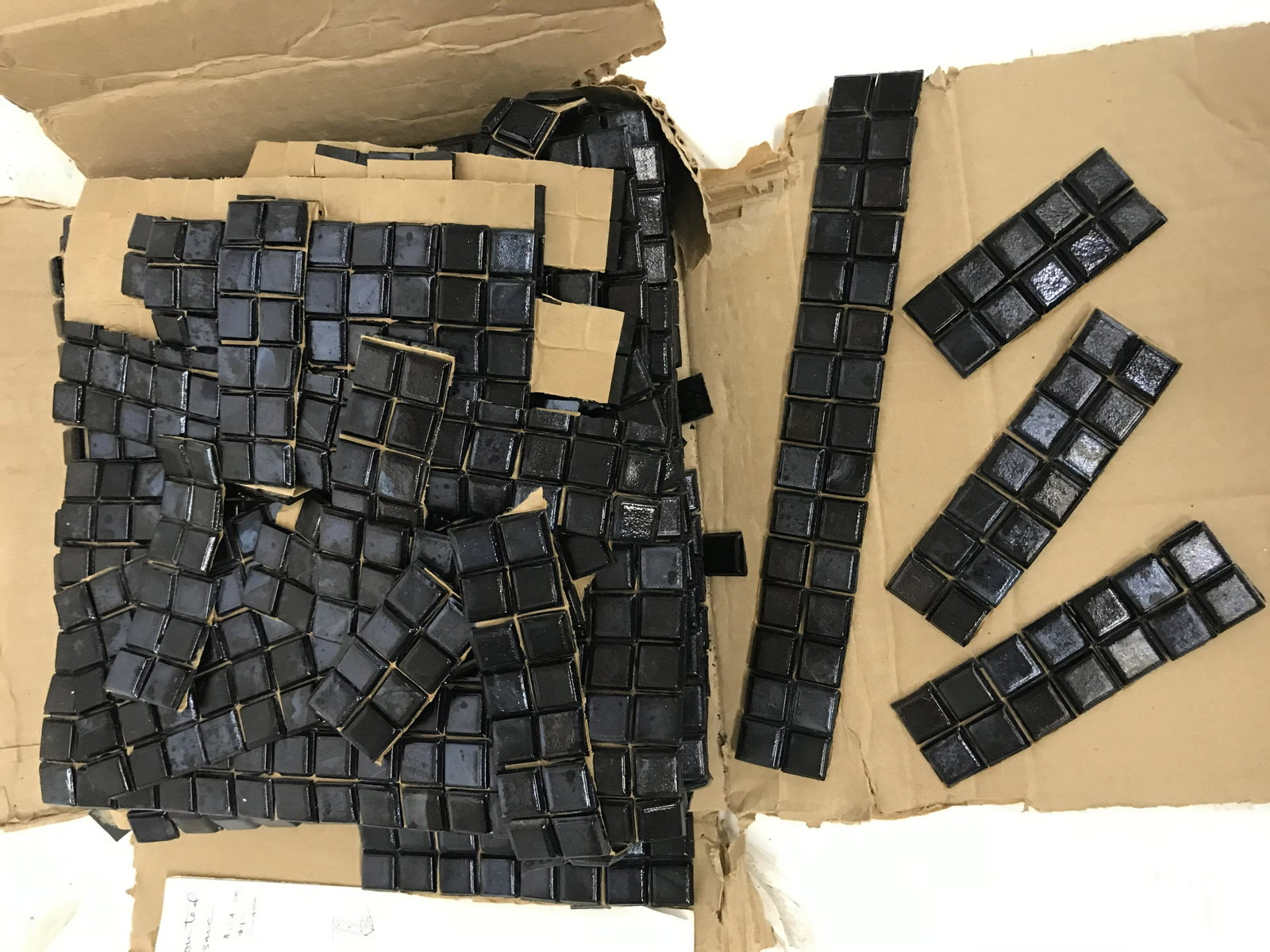 Vidrotil Mosaic Glass Tile Never Used Glossy Black: Box of Vidrotil Glass Tile made in Brazil. Glossy black textured squares each is 3/4" mounted on paper. 10 full sheets that are just over a foot square, and a lot of miscellaneous.