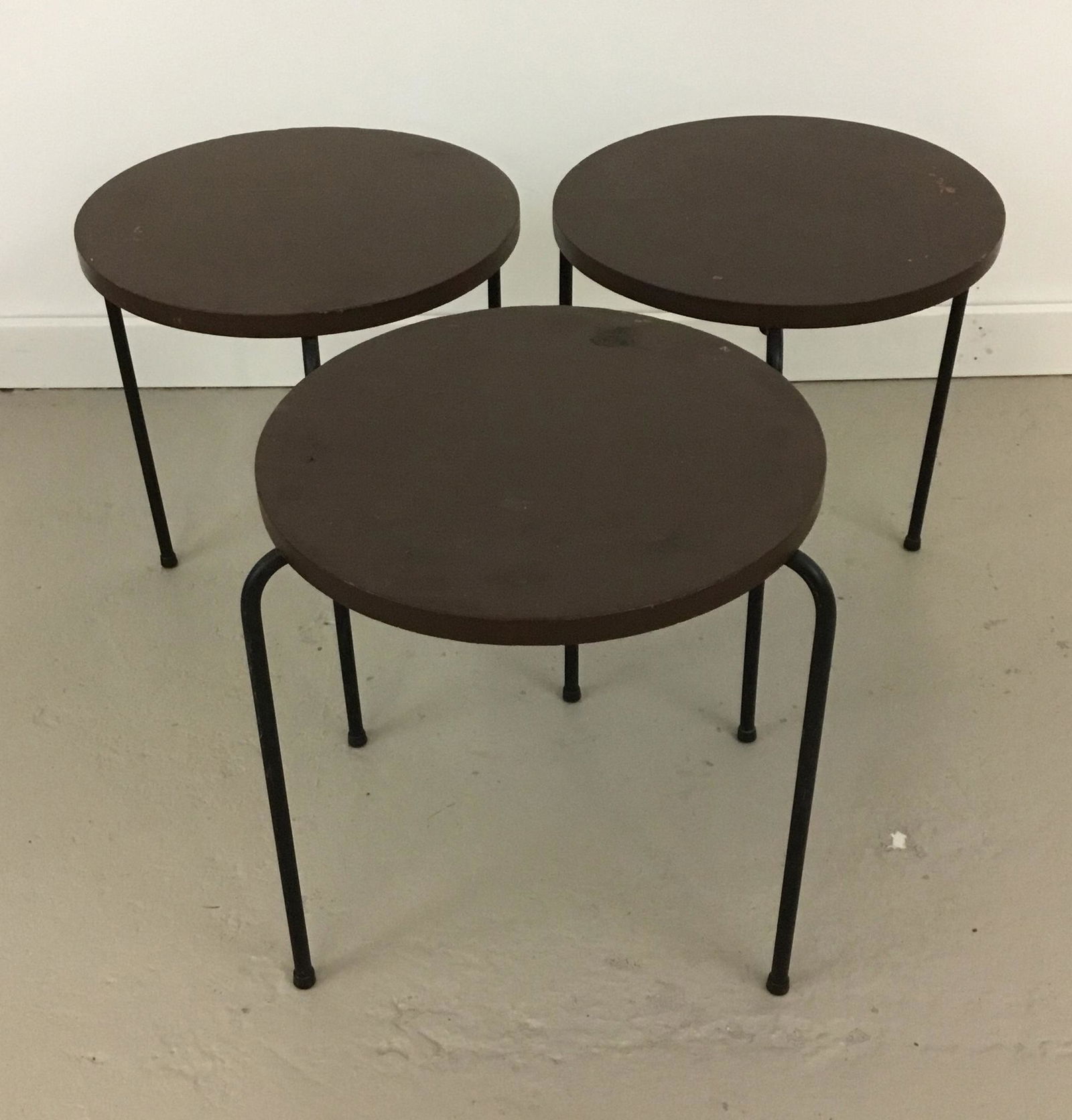 Set of 3 Luther Conover Iron and Wood Stacking Stools: 3 stacking stools or side tables in painted wood and iron, attributed to Luther Conover. Brown paint on tops. Tops are 14.5” across and they are 16.75” tall.