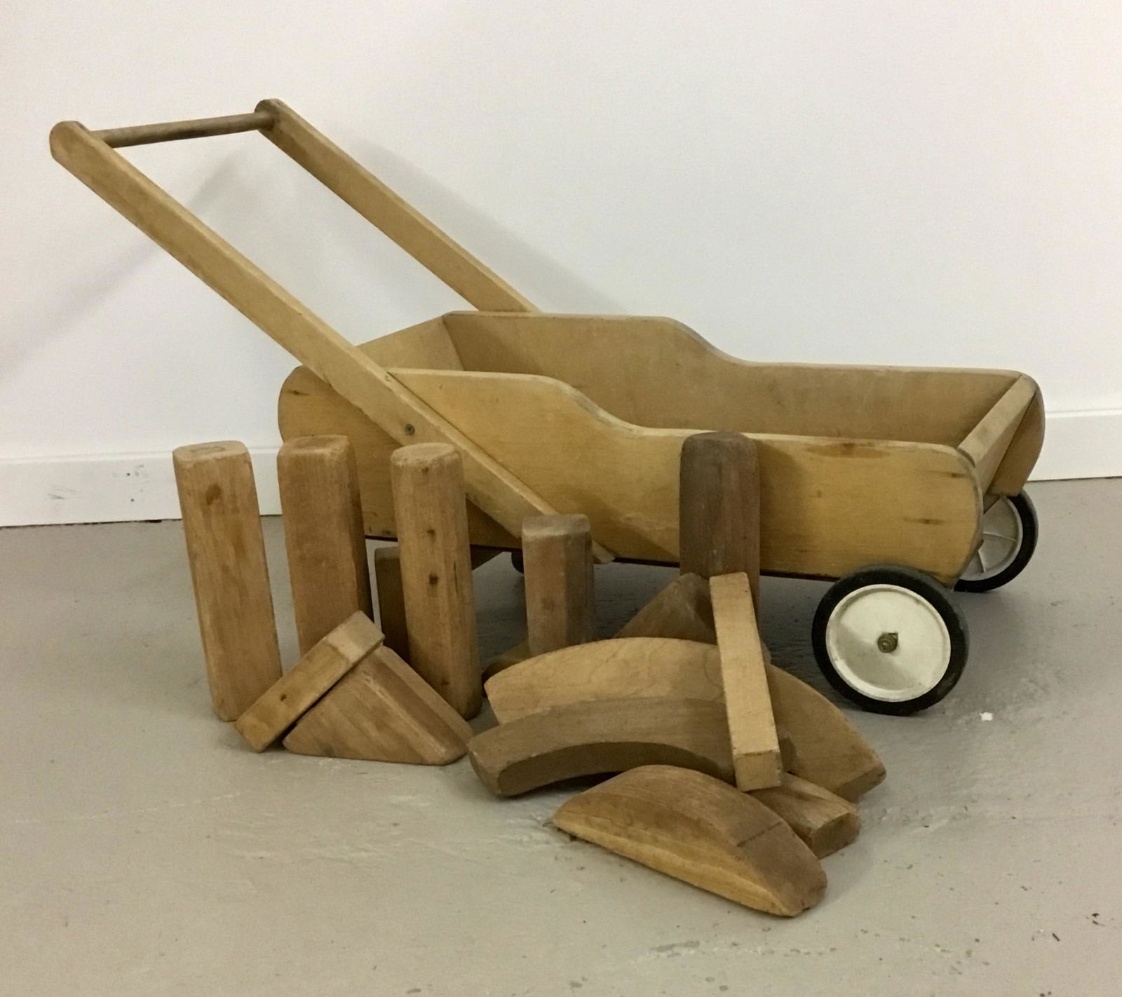 Vintage Childâ€™s Wooden Wagon with Blocks: Great vintage wagon with all blocks shown. May be vintage Creative Playthings or Playskool. Rolls well. 36” long including handle, 14” wide, 12” tall.