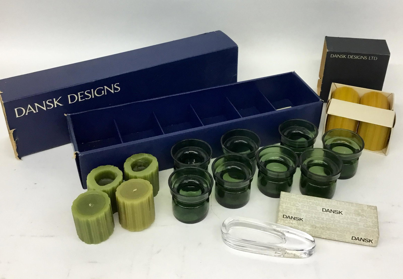 Lot of Vintage Dansk Candleholders, Candles, Ashtray: Vintage Dansk - 8 glass candle holders in bottle green, with 4 candles in original box (2 of the green candles have been used, 2 have not), a box of yellow candles all unused, and a glass teardrop sha