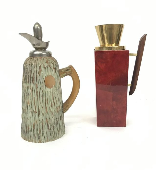 Lot of 2 Aldo Tura Carafes: Aldo Tura caraffes. One in wood one in red parchment over wood. Dry cork in wood and no stopper in red. Tallest 11/25"h