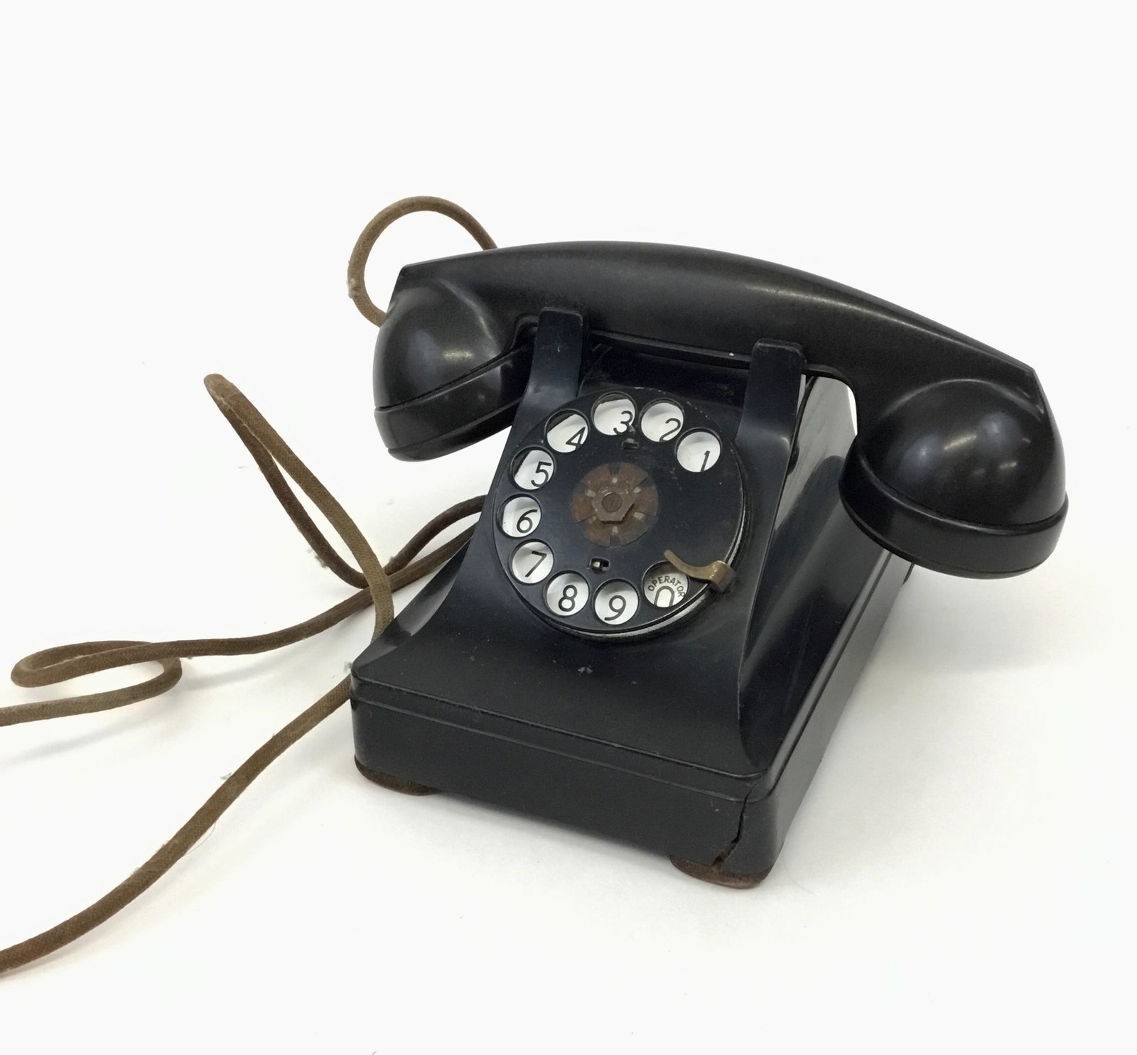 Antique Western Electric Telephone: Antique Western Electric Company black bakelite phone with cloth cord.
