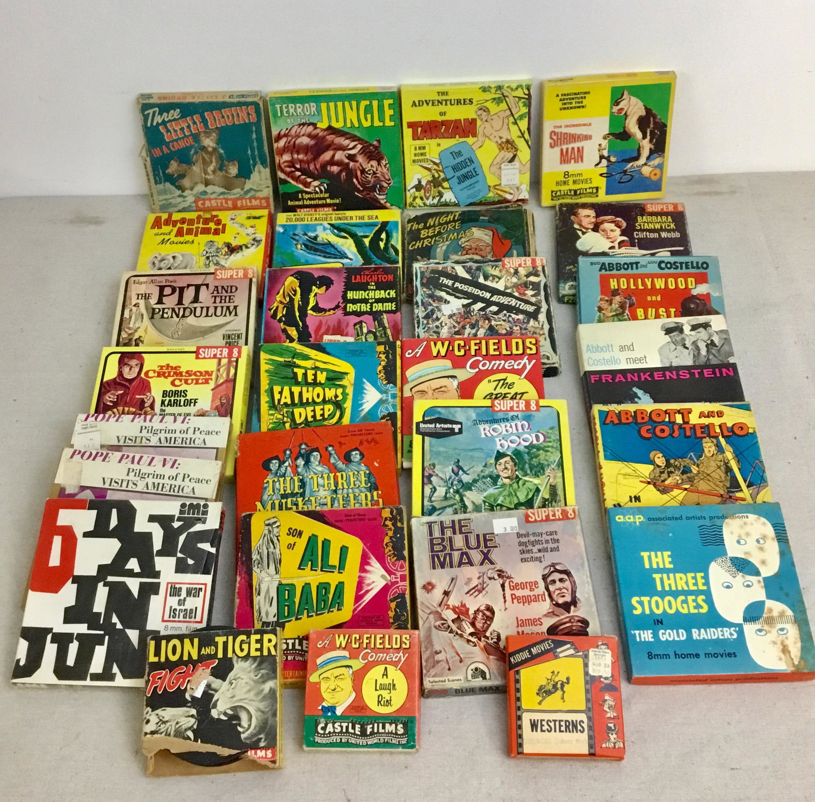 Lot Vintage 8mm Super8 Movies Mixed Lot 6 Days in June: Lot of 24 vintage movies including Tarzan Abbott and Costello Terror in the Jungle Robin Hood and more. The Lion and Tiger Fight one is thicker, may be 16mm.
