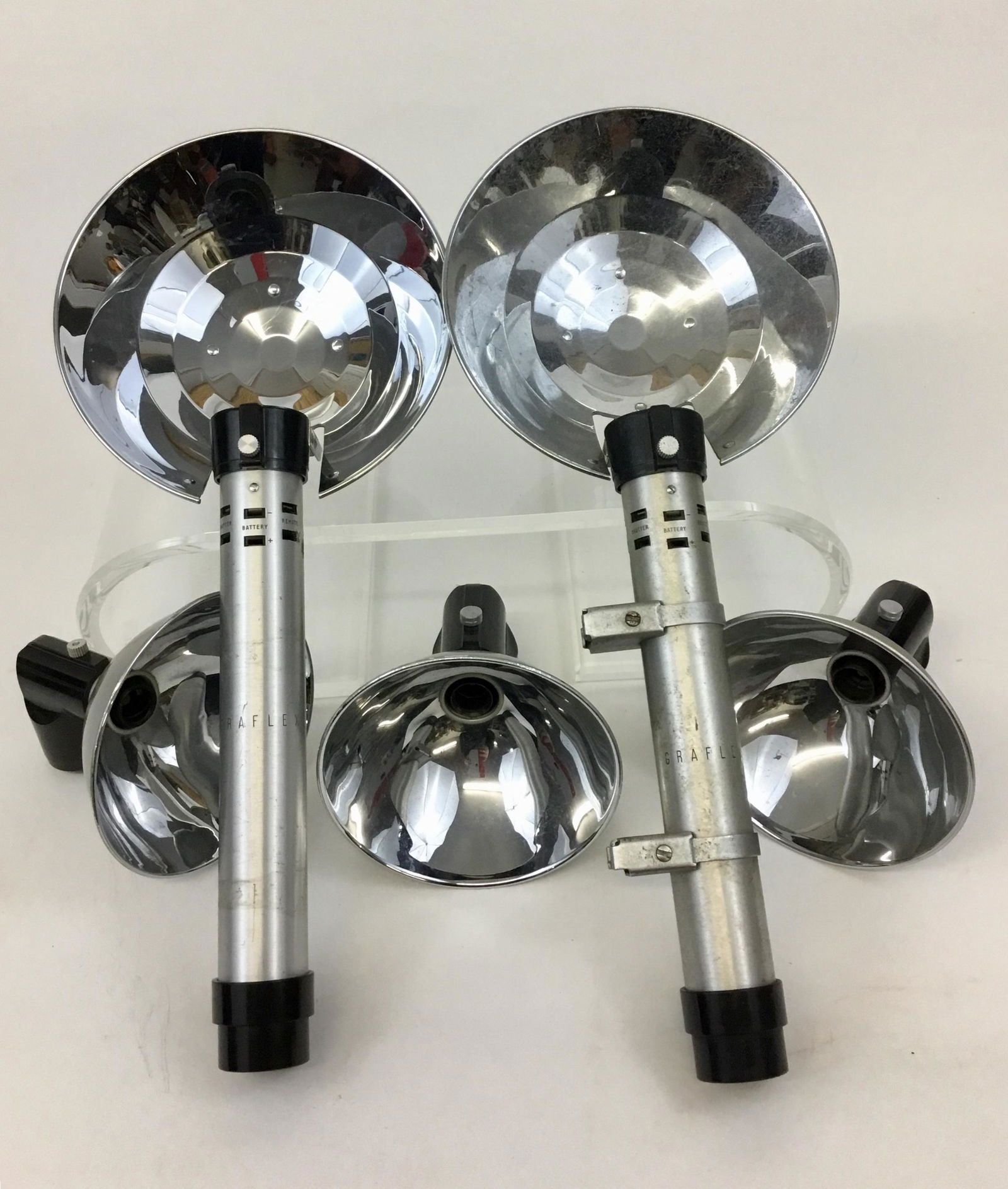 Graflex Flashgun Flash Units 7 Inch Size: Vintage Graflex flash gun units two are 7” with the handles and 3 are 5” and say Graflex Reflector inside the connector.