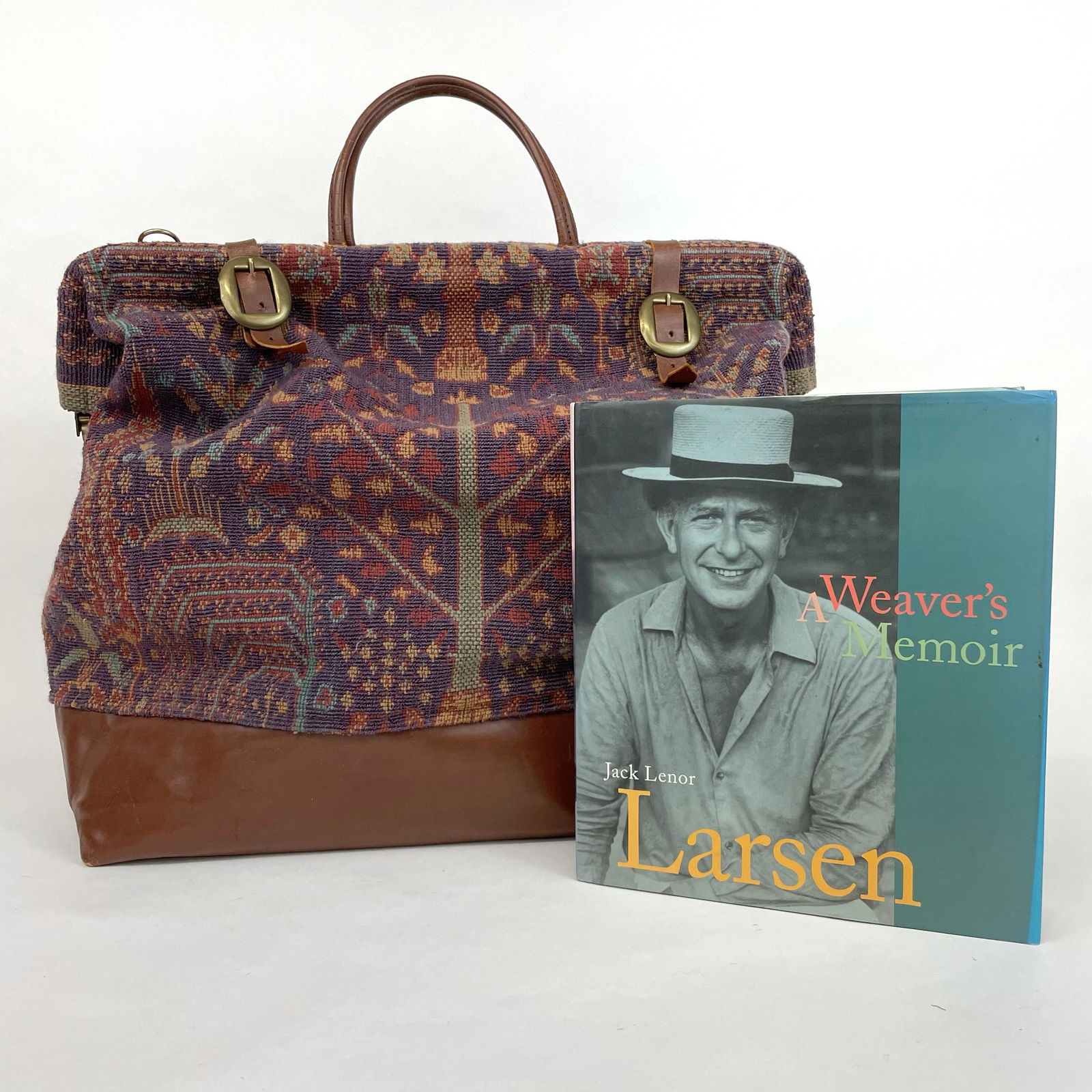 Jack Lenor Larsen Rare Carpetbag and Signed Book: This came out of the collection of a long time employee of Larsen's. We were told that this was a bag given to sales reps, that these were never produced to be sold. Wonderful tapestry style fabric an