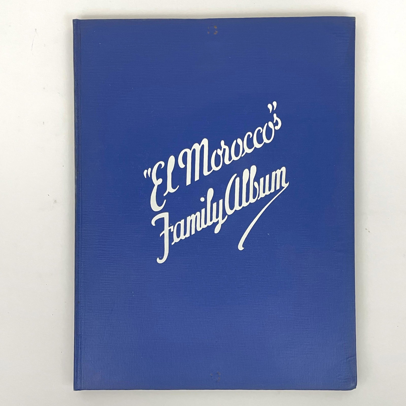 John Perona's El Morocco's Family Album 1937 Zerbe: First edition, large size with blue boards and terrific endpaper. Original envelope included. Jerome Zerbe photographs of Prohibition era NYC nightlife. Very good condition with slight indentation on 
