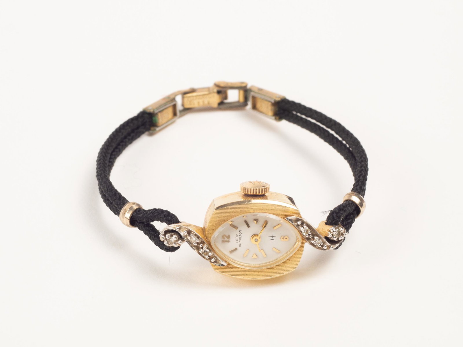 14K Gold Lady Hamilton Wrist Watch with Diamonds: Pretty vintage ladies watch by Hamilton, with a 14 K yellow gold case and small diamonds.