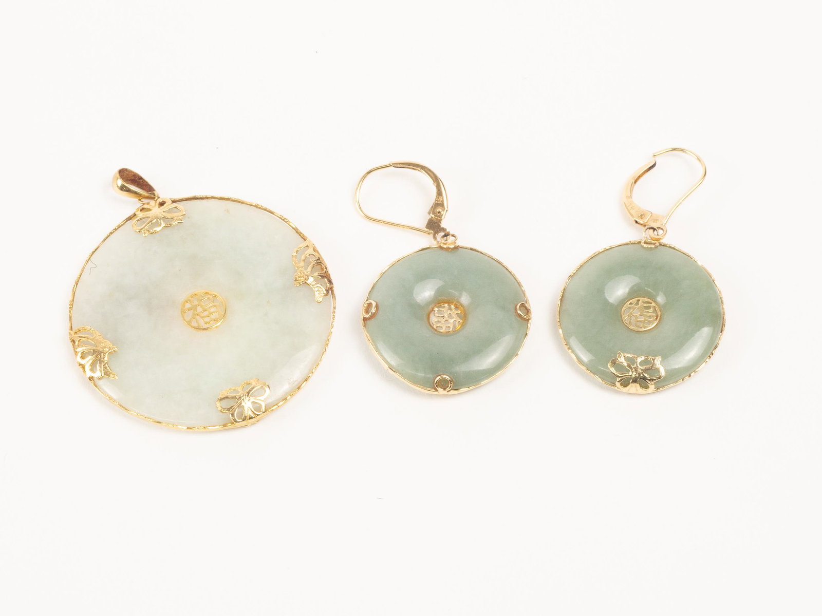Jade and 14K Gold Earrings & Pendant: Very pretty round jade pendant and earrings set in 14 k yellow gold. Pendant is 1.5" across and earrings are 15/16" across.