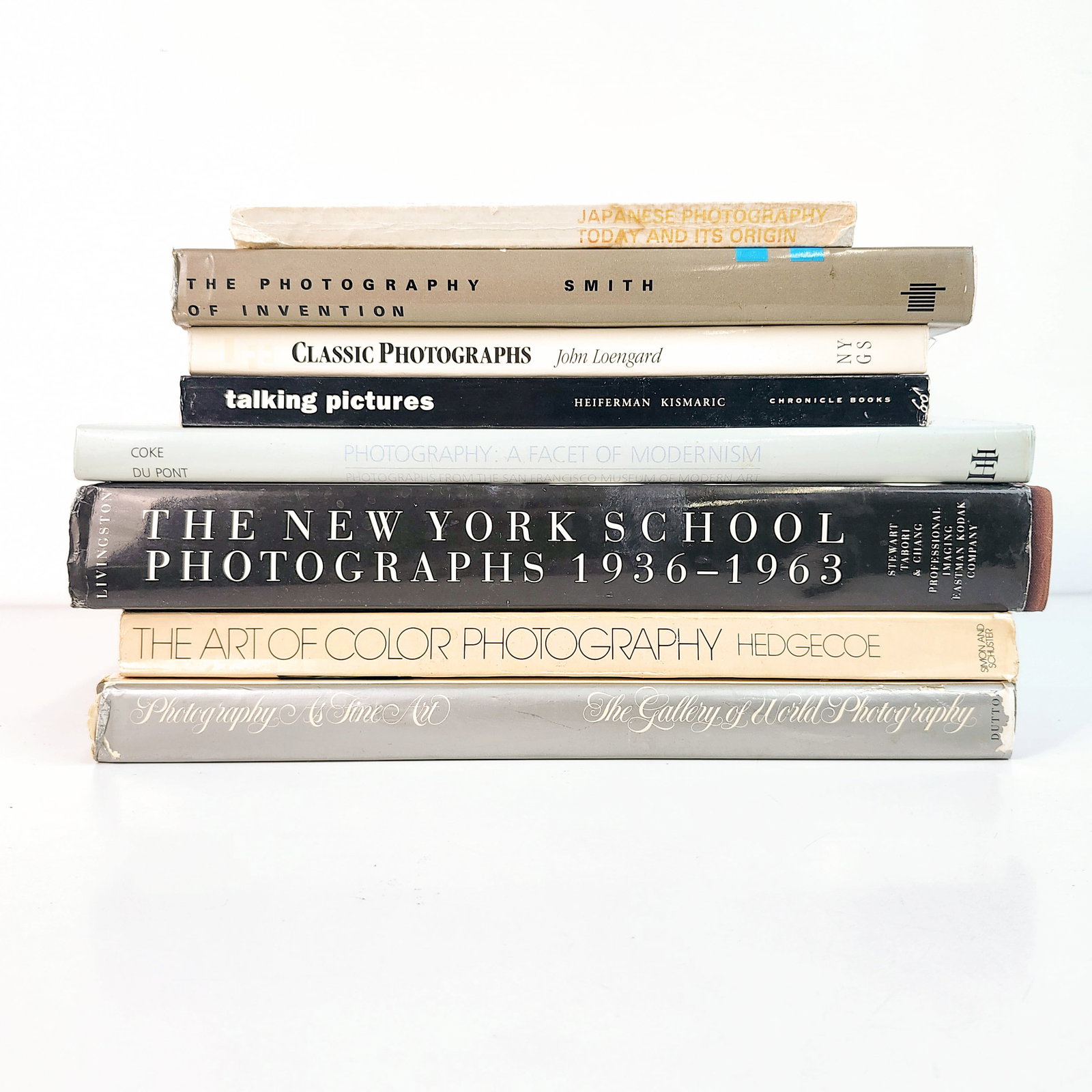 8 Books on Photography Genres: 8 Photobooks on different subgenres including The New York School Photographs, The Art of Color Photograph, and Japanese Photography Today and more (AJ) H7" W10" D12" (Dimensions of stack of books)