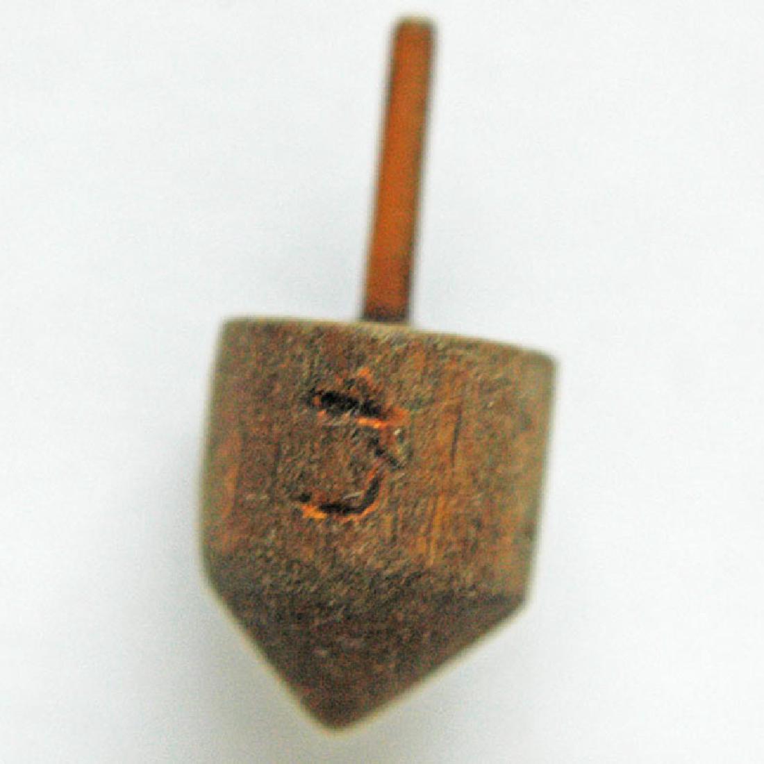 Jewish WW2 Children GAME Drejdel, Litzmannstadt 1941: This item depicted in the images below is a rare Jewish WW2 VERY OLD Wood Children GAME Drejdel from Litzmannstadt in Poland. The size is 28 x 13 mm. 100% original ! The item bought on eBay from real 